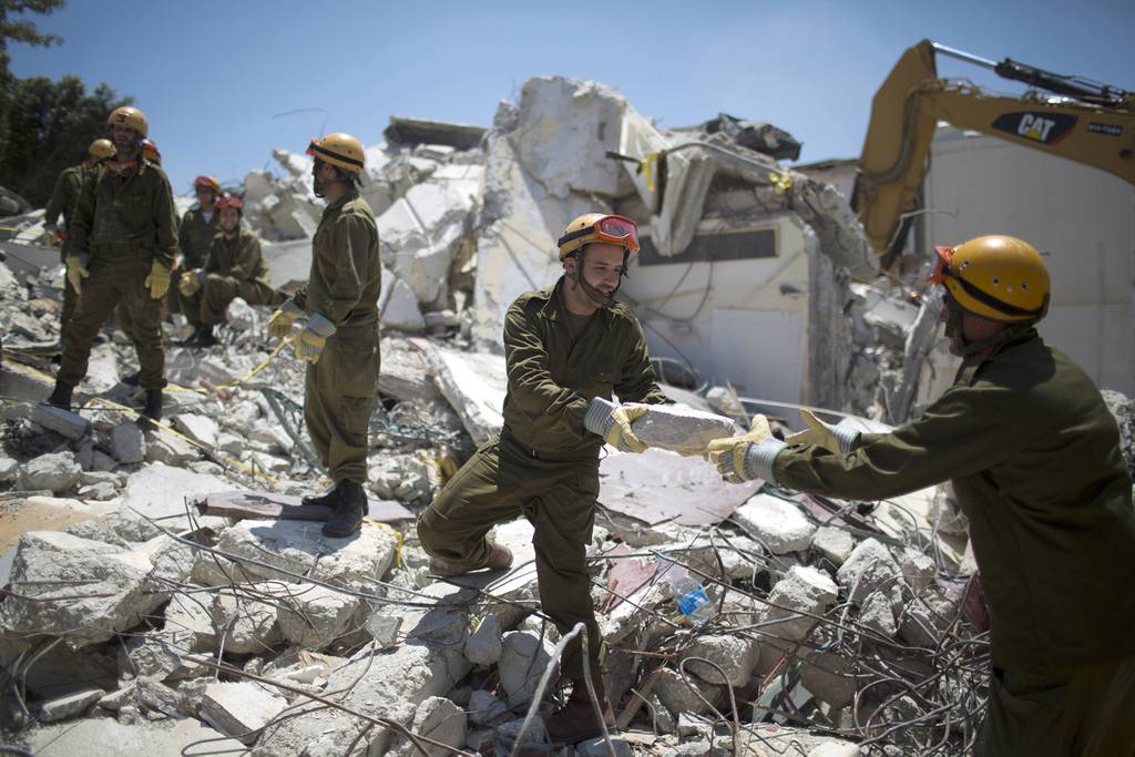 Israeli soldiers of the Home Front Command rescue unit take part in a search and rescue drill