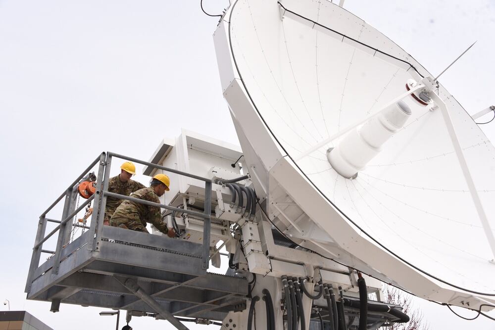 Soldiers with the 53rd Signal Battalion work on an antenna at the Wideband Satellite Communications Operations Center at Fort Meade, Maryland, on March 29, 2018. The Satellite Operations Brigade executes continuous tactical, operational and strategic satellite communications payload management in support of combatant commands, services, U.S. government agencies and international partners. (Carrie David Campbell/Army)