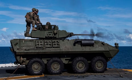 Marines fire a Light Armored Vehicle (LAV) M242 Bushmaster 25mm chain gun during a drill aboard the amphibious assault ship USS Wasp (LHD 1) Aug. 7, 2019, in the Pacific Ocean.