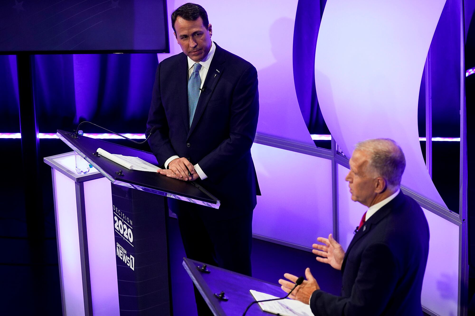 U.S. Sen. Thom Tillis, R-N.C., right, speaks as Democratic challenger Cal Cunningham listens during a televised debate on Oct. 1, 2020, in Raleigh, N.C.