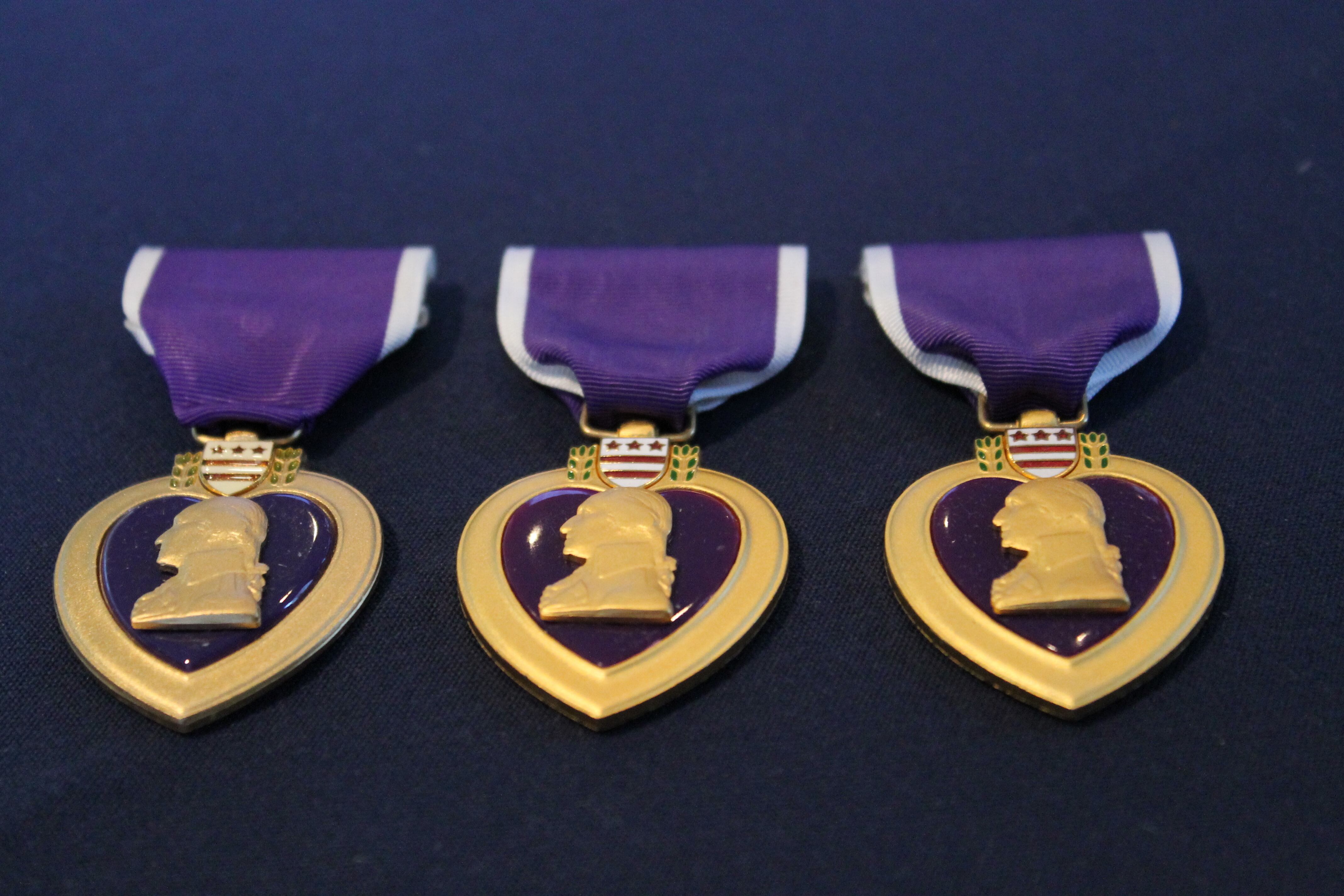 The Purple Heart Medal is linked to the Badge of Military Merit established by George Washington during the Revolutionary War when he pinned a purple, cloth-shaped heart on three men's chests.