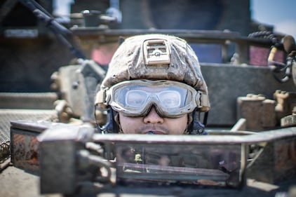 Lance Cpl. Tommy Vu, a light armored vehicle crewman, sits in an LAV during a field exercise at Marine Corps Base Camp Pendleton, Calif., May 28, 2020.