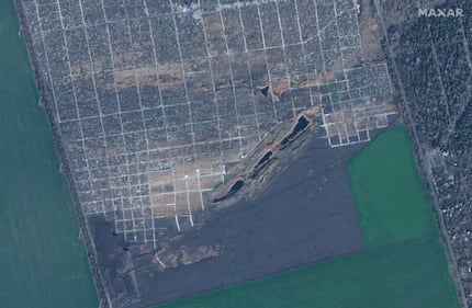 Satellite image shows new graves at a cemetery in Mariupol, Ukraine, Nov. 30, 2022.