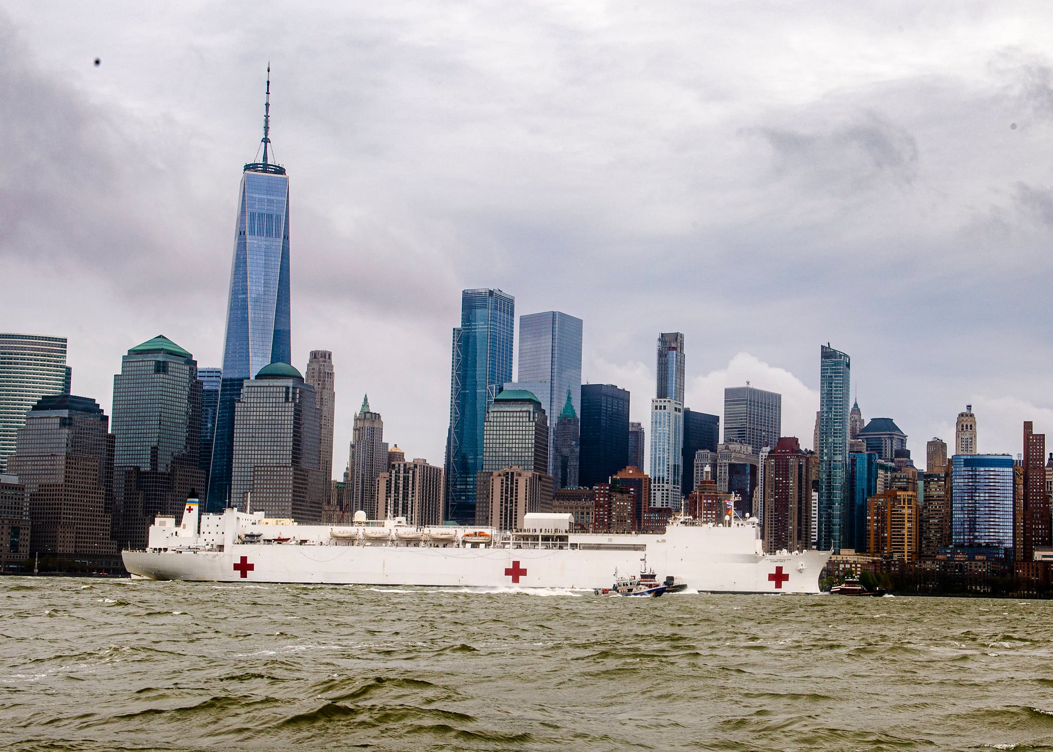 The hospital ship USNS Comfort (T-AH 20) departs New York Harbor