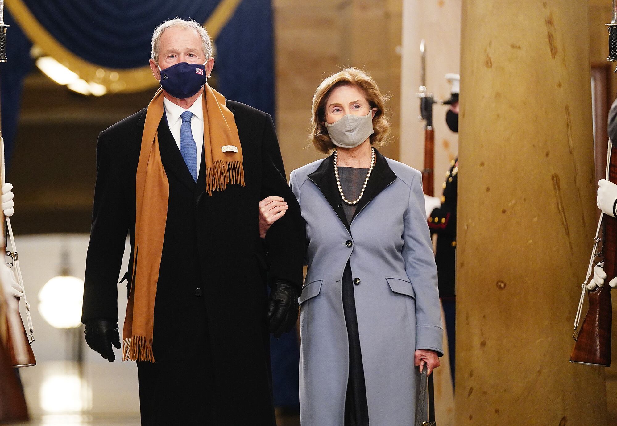 Former President George W. Bush and Laura Bush arrive before President-elect Joe Biden is sworn in as the 46th president on Jan. 20, 2021, at the Capitol in Washington.