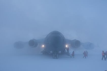 Passengers disembark a U.S. Air Force C-17 Globemaster III, assigned to Joint Base Lewis-McChord, Wash., at McMurdo Station, Antarctica, Sept. 14, 2020.