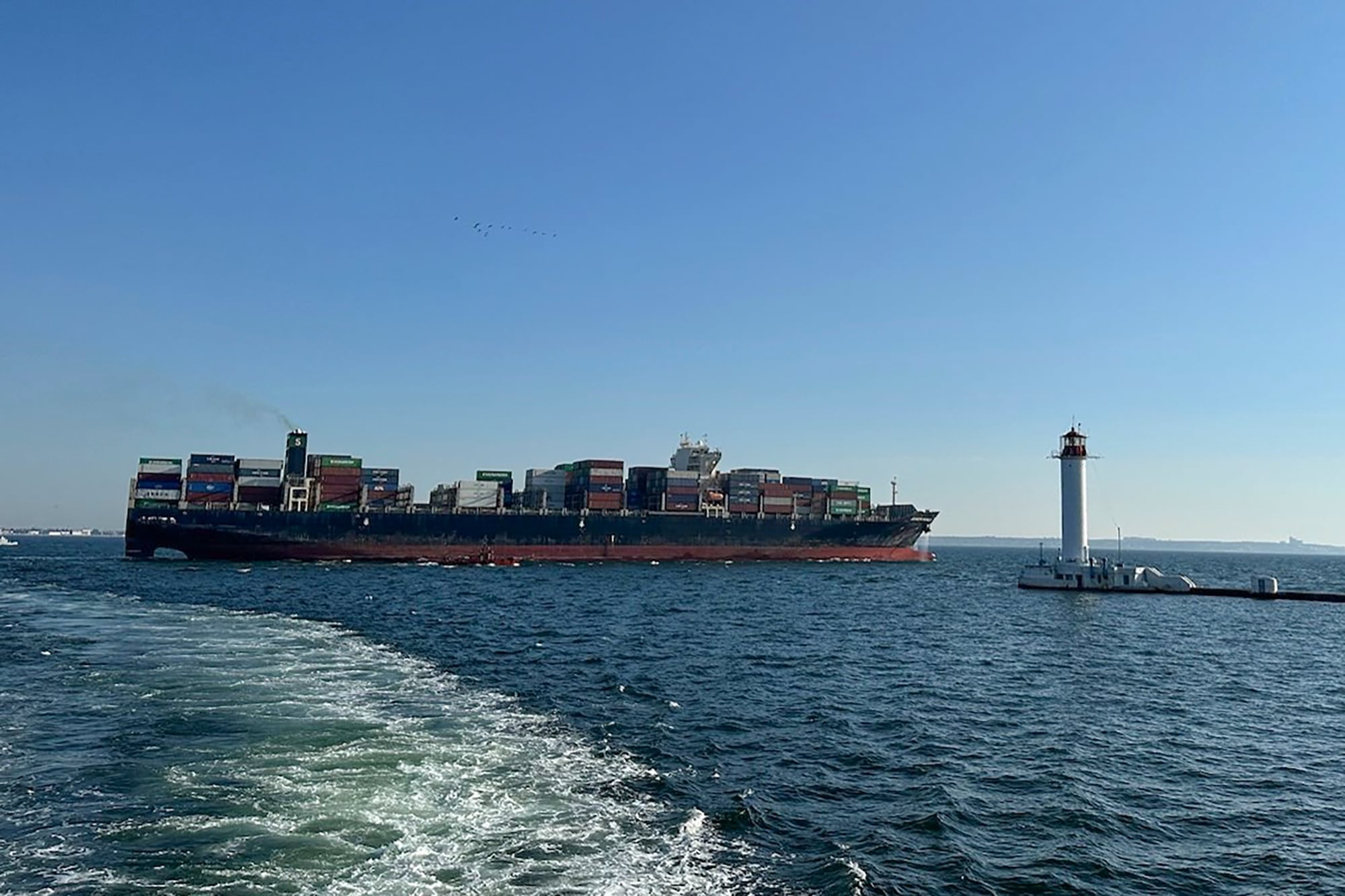 In this photo provided by Ukraine's Infrastructure Ministry Press Office, container ship Joseph Schulte (Hong Kong flag) leaves the port of Odesa to proceed through the temporary corridor established for merchant vessels from Ukraine's Black Sea ports in Odesa, Ukraine, Wednesday, Aug. 16, 2023.