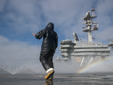 Aviation Boatswain's Mate (Handling) Airman Michael Meneses inspects the flight deck's countermeasure wash-down sprinklers on the aircraft carrier USS Abraham Lincoln (CVN 72) on May 16, 2020, in the Pacific Ocean.