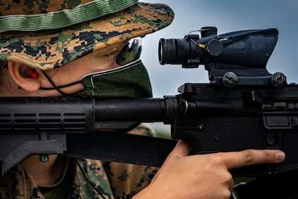 Marine Corps Lance Cpl. Faith Rose sights in on her target on Camp Hansen, Okinawa, Japan, May 6, 2020. Despite the outbreak of COVID-19, rifle ranges are still operating and enabling Marines to complete their yearly qualifications.