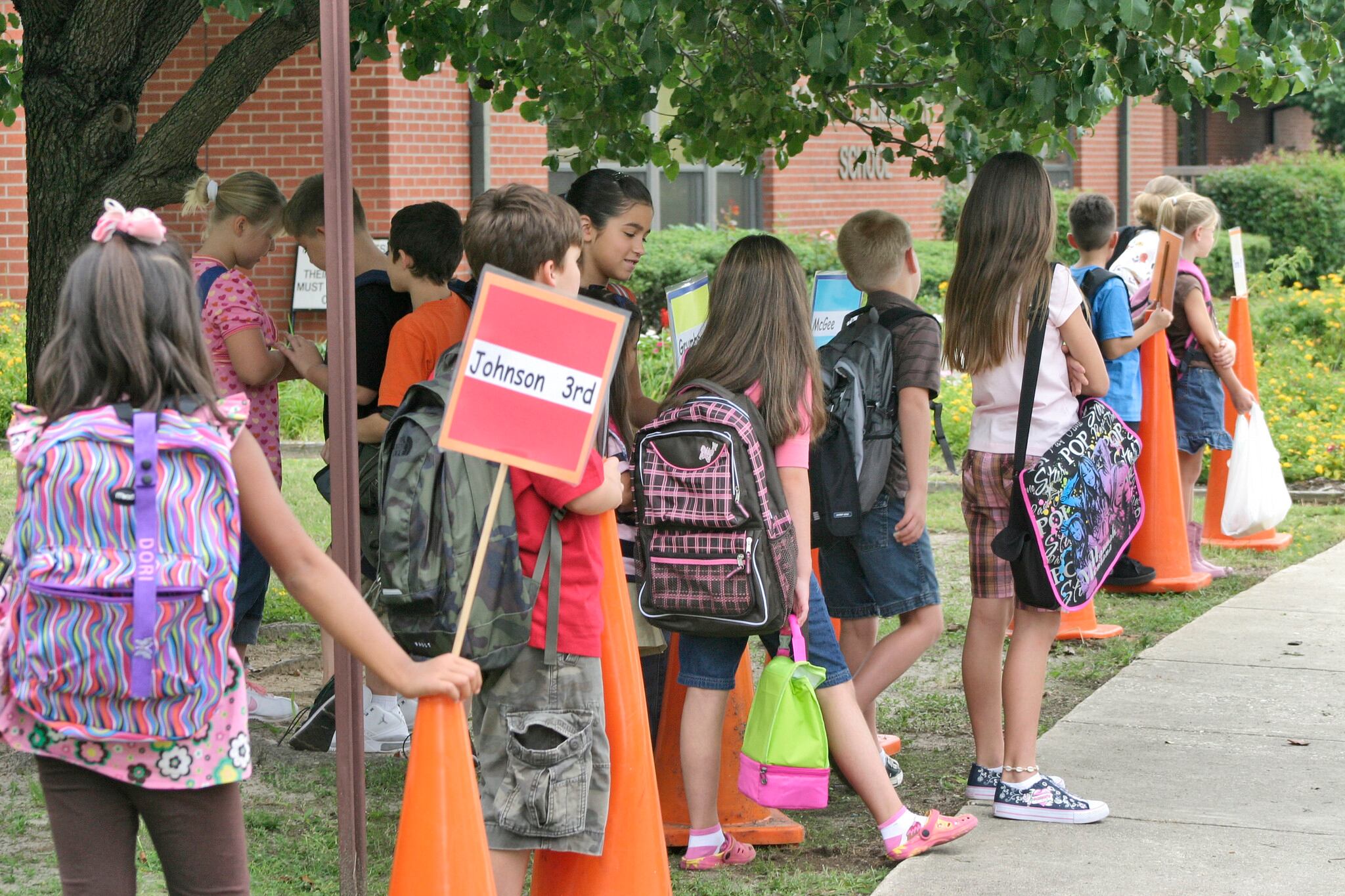 Students at Fort Bragg's Bowley Elementary School line up by class in the front of the school as they wait for their parents to pick them up after the first day of school in 2008.