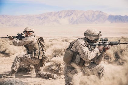 Cpl. Sathya Breckinridge and Lance Cpl. Keavious Blackmon provide cover during Integrated Training Exercise 1-21 at Marine Air Ground Combat Center Twentynine Palms, Calif., Oct. 5, 2020.