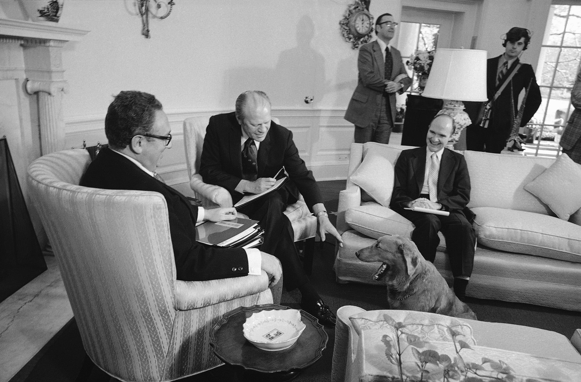 In this Nov. 16, 1974, file photo, Liberty, President Gerald Ford's golden retriever, receives greetings from the president as he made an unexpected visit to the Oval Office.