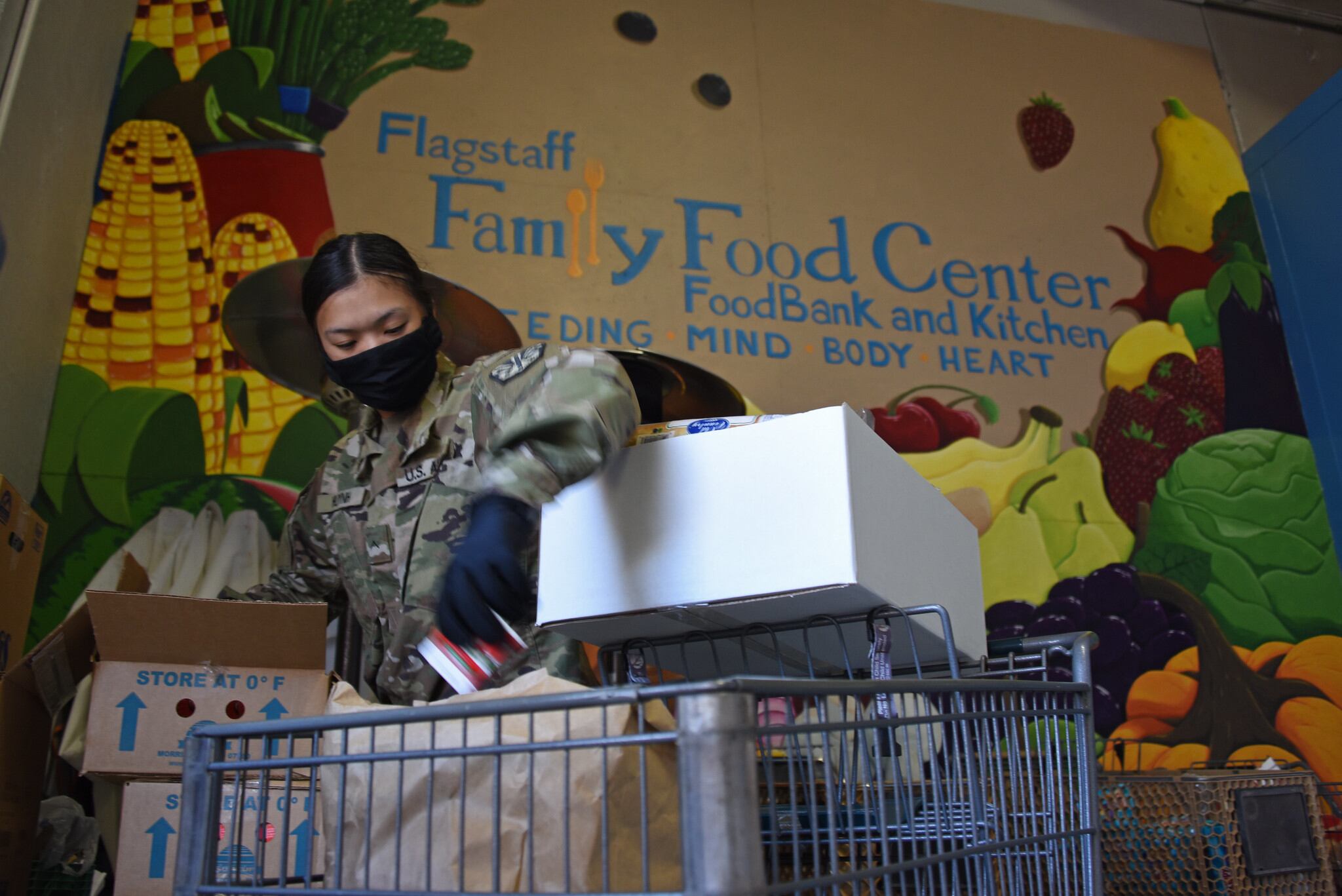 Arizona National Guard personnel deliver boxes of fresh produce and groceries to residents of Coconino County, Ariz., April 7, 2020, at Flagstaff Family Food Center.