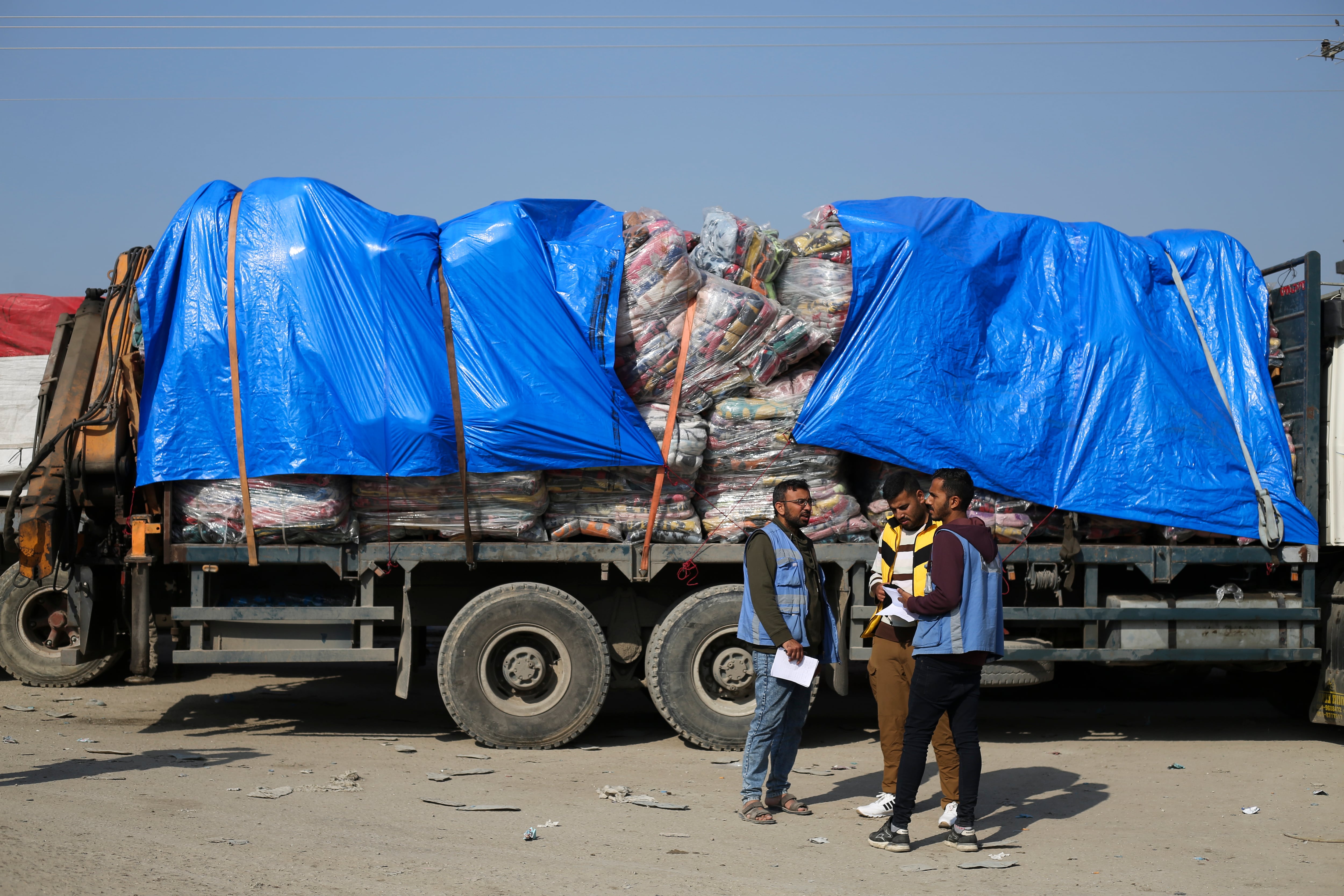 Humanitarian aid trucks enter through the Kerem Shalom crossing from Israel into the Gaza Strip on Monday, Dec. 18, 2023.