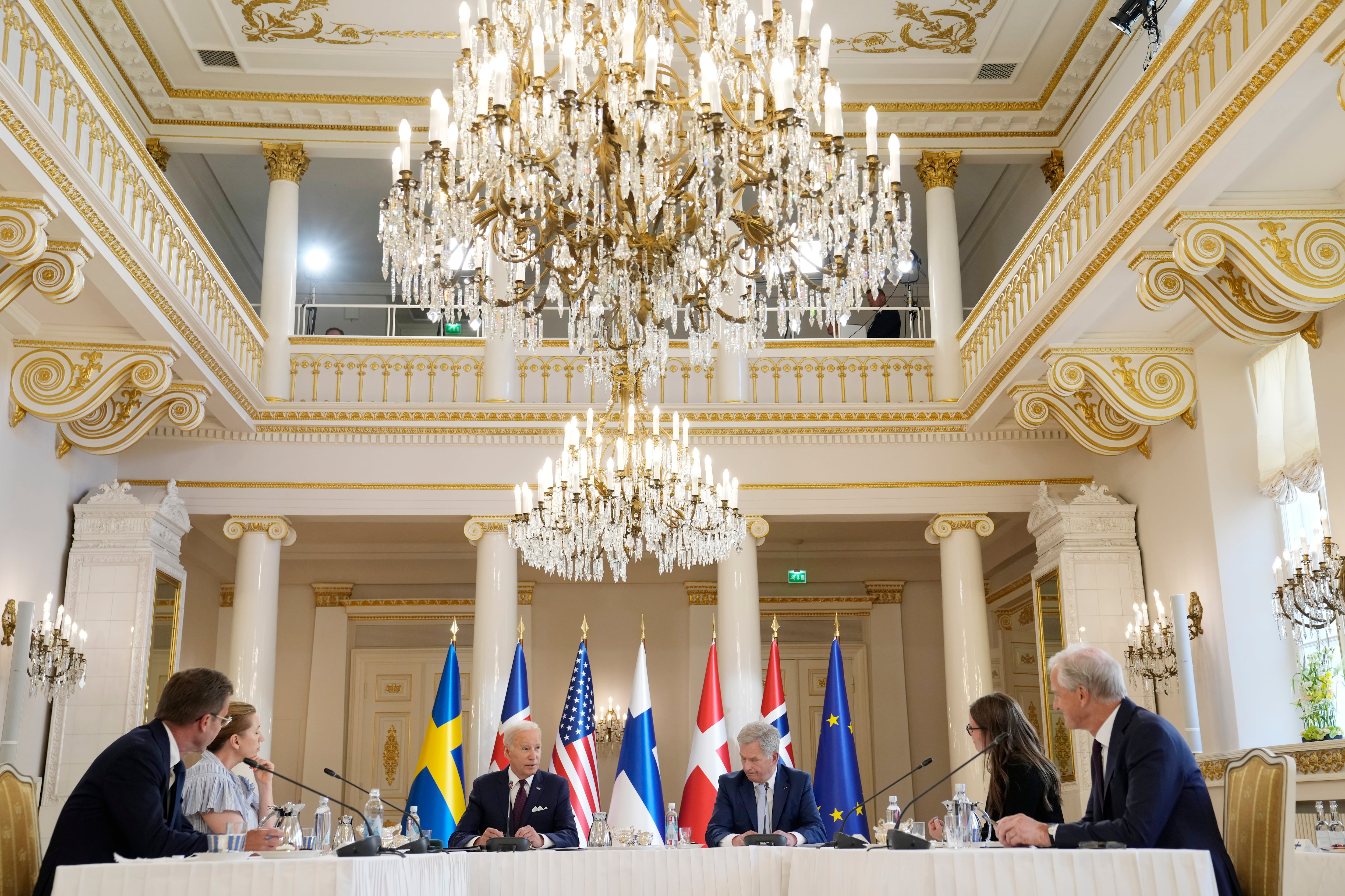 President Joe Biden speaks with Nordic leaders from left, Sweden's Prime Minister Ulf Kristersson, Denmark's Prime Minister Mette Frederiksen, Biden, Finland's President Sauli Niinisto, Iceland's Prime Minister Katrin Jakobsdottir and Norway's Prime Minister Jonas Gahr Store, at the Presidential Palace in Helsinki, Finland, July 13, 2023.