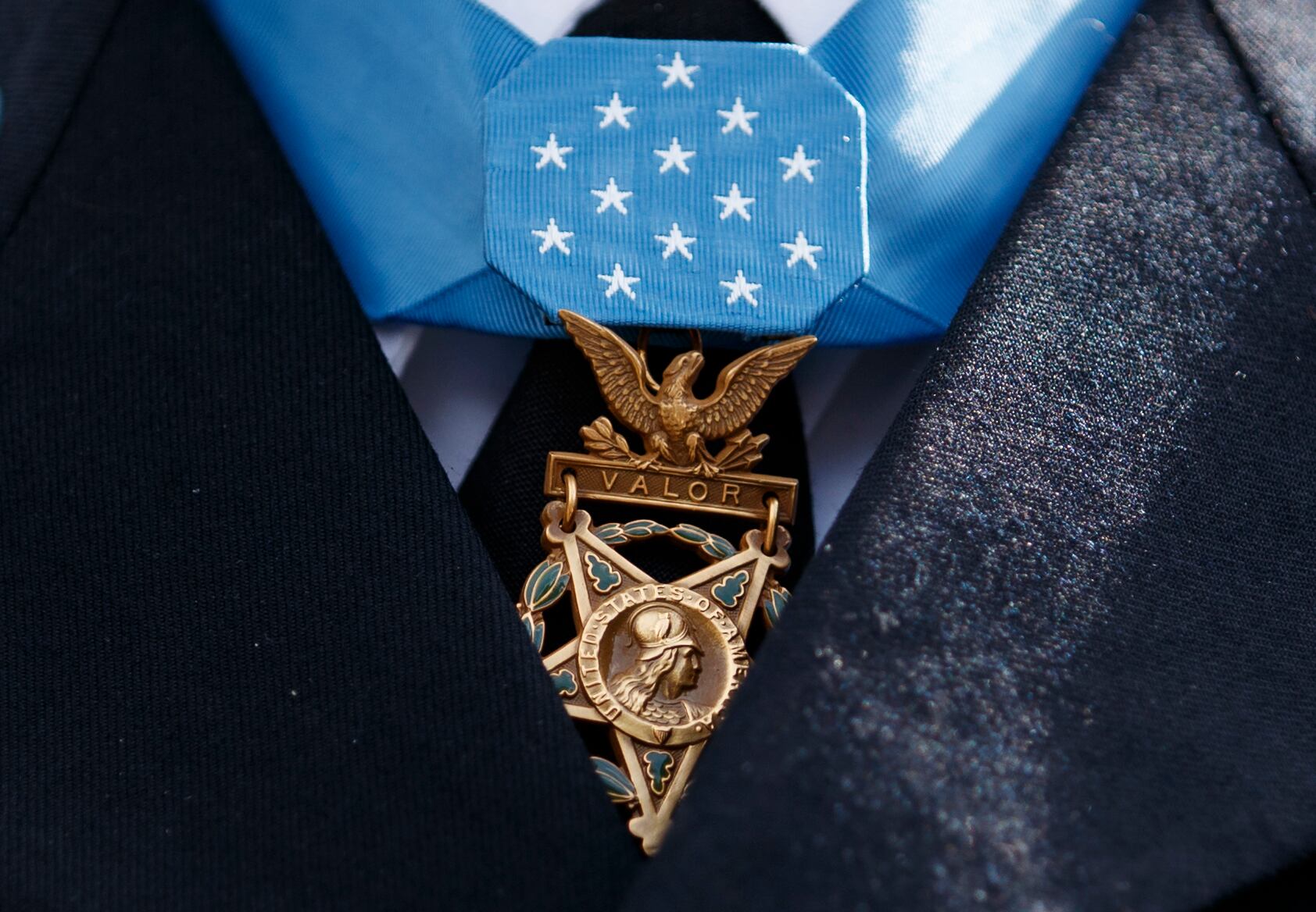 The Medal of Honor is seen around the neck of Medal of Honor recipient Army Staff Sgt. David Bellavia outside the West Wing of the White House in Washington, June 25, 2019.