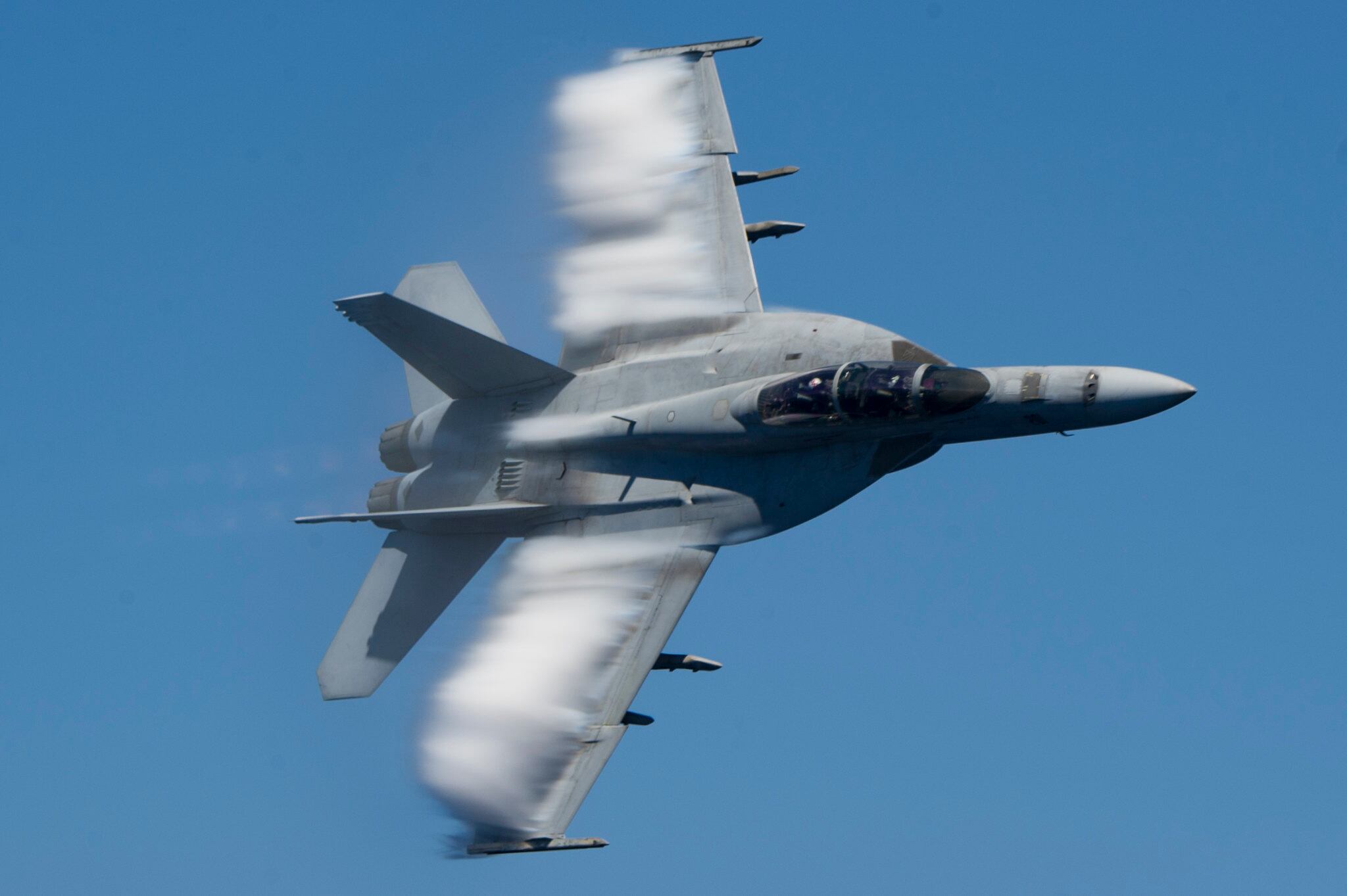 An F/A-18E Super Hornet performs a fly-by June 26, 2018,  ofthe Nimitz-class aircraft carrier USS Harry S. Truman (CVN 75) in the Mediterranean Sea.