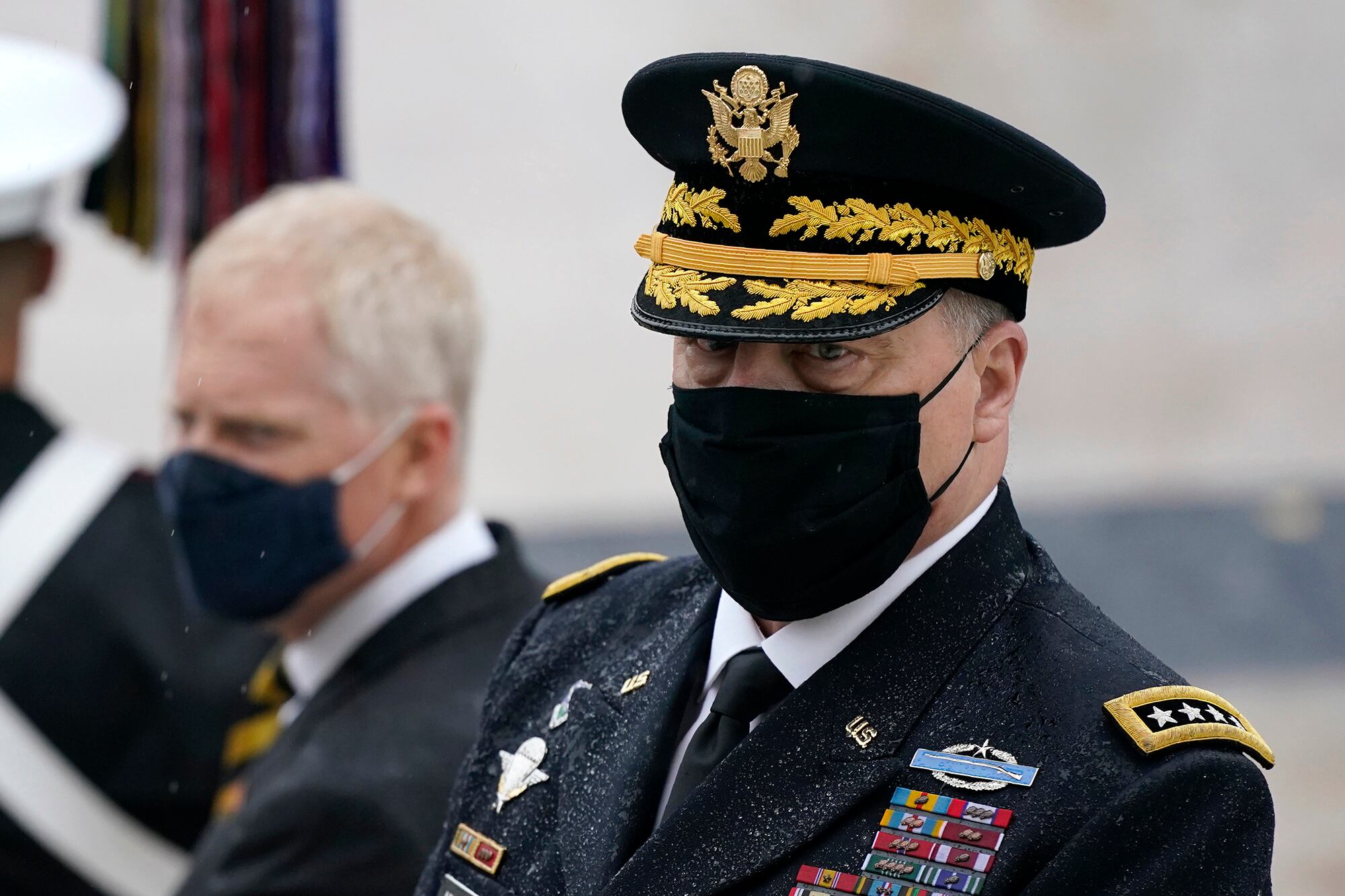 Joint Chiefs Chairman Gen. Mark Milley attends a Veterans Day wreath-laying ceremony led by President Donald Trump at the Tomb of the Unknown Soldier at Arlington National Cemetery in Arlington, Va., Wednesday, Nov. 11, 2020.