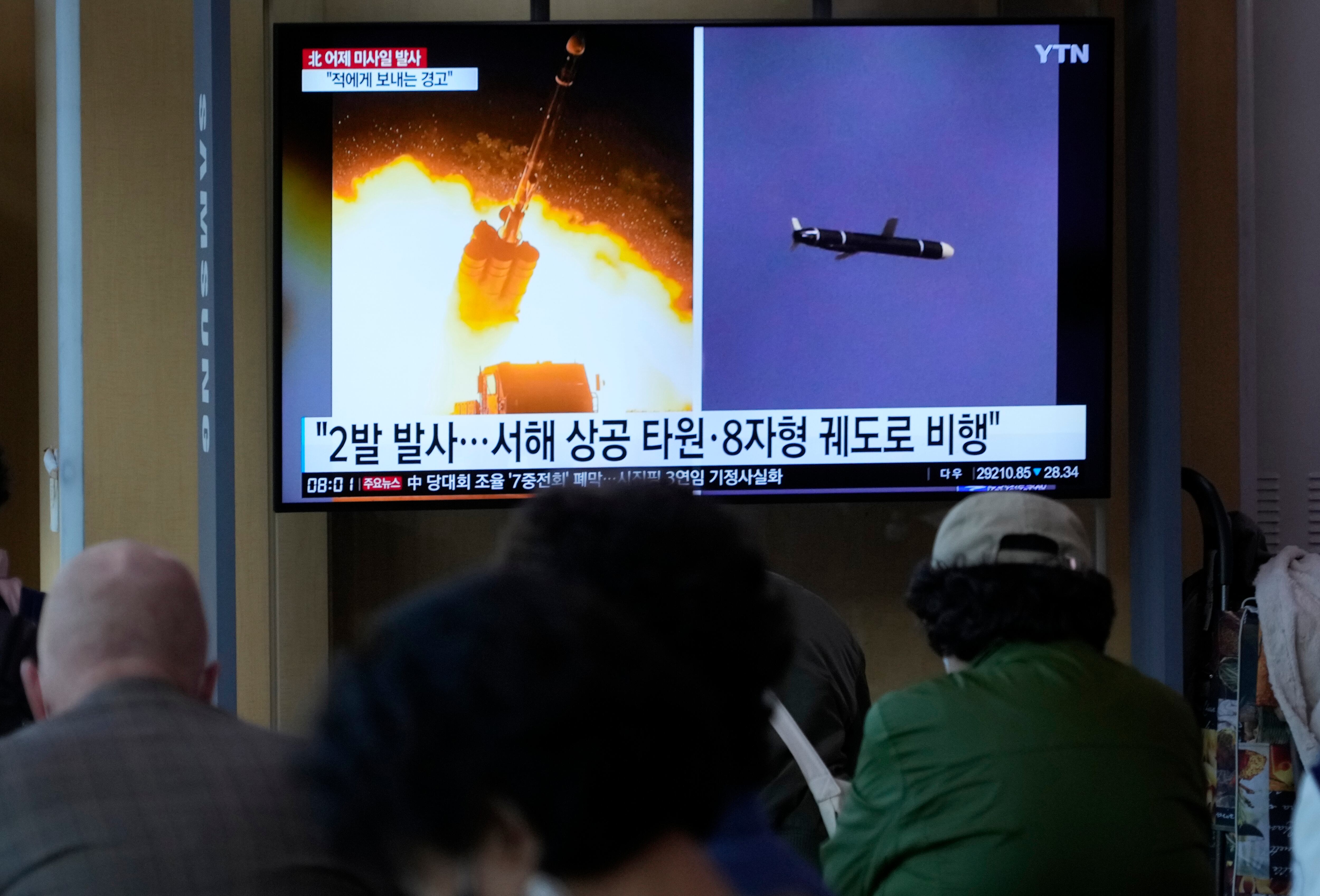 A TV screen shows file images of North Korea's missile launch during a news program at the Seoul Railway Station in Seoul, South Korea, Thursday, Oct. 13, 2022.