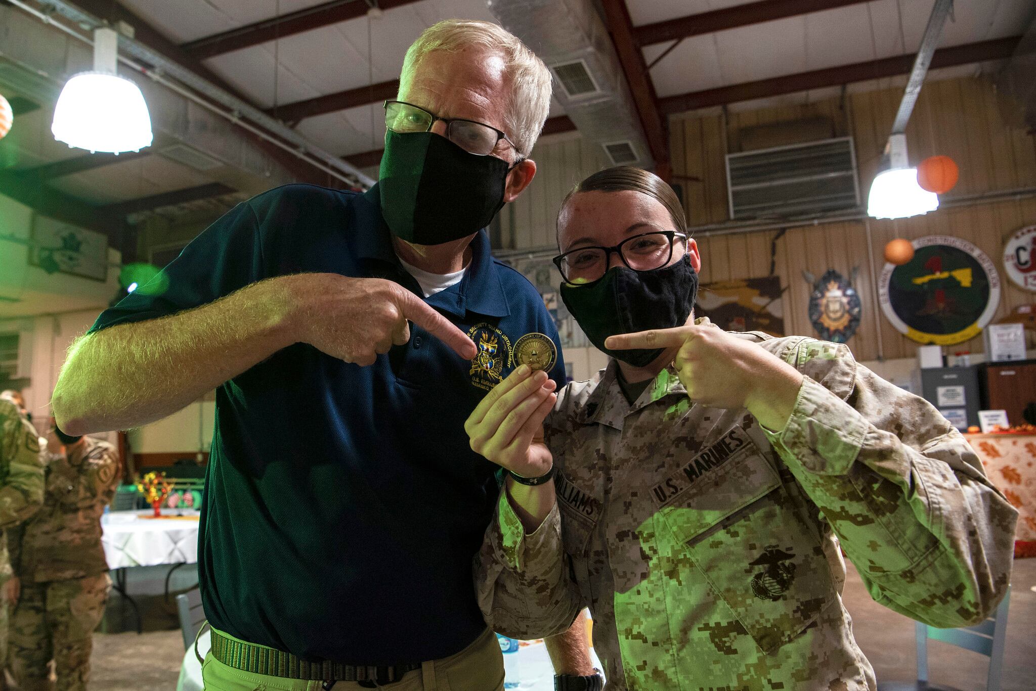 Acting Defense Secretary Christopher C. Miller points to the Secretary of Defense coin he presented during a Thanksgiving Day visit at Camp Lemonnier, Djibouti, Nov. 26, 2020.