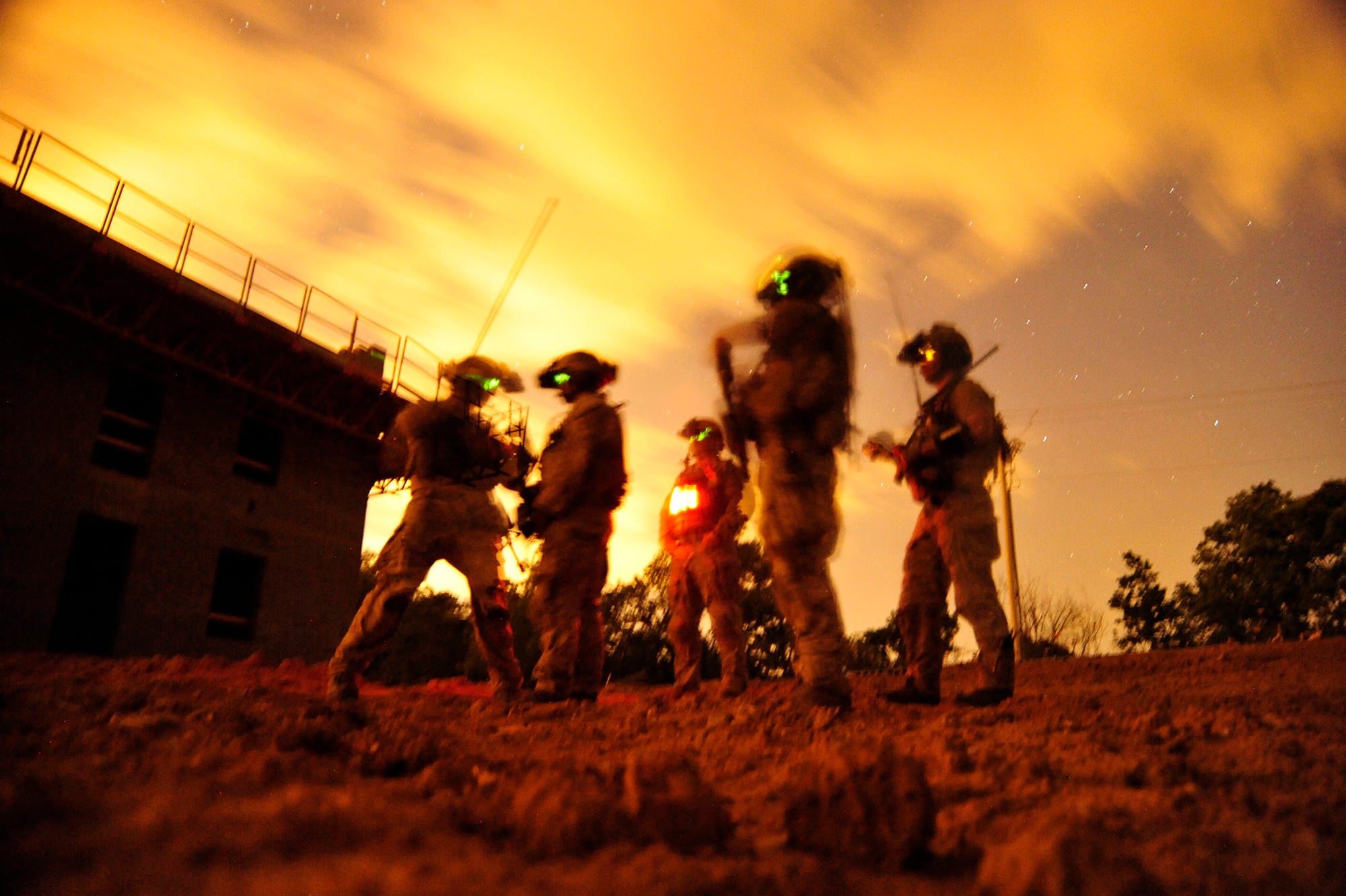 In this 2012 photo made available by the U.S. Navy, a squad of Navy SEALs participate in special operations urban combat training at an undisclosed location.