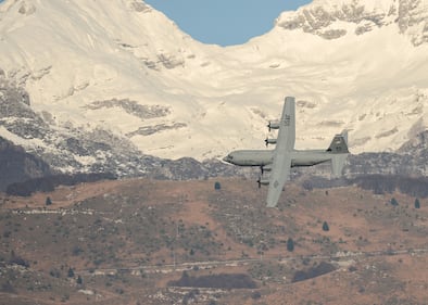 Hercules Airmen de-ice aircraft, re-ice each other