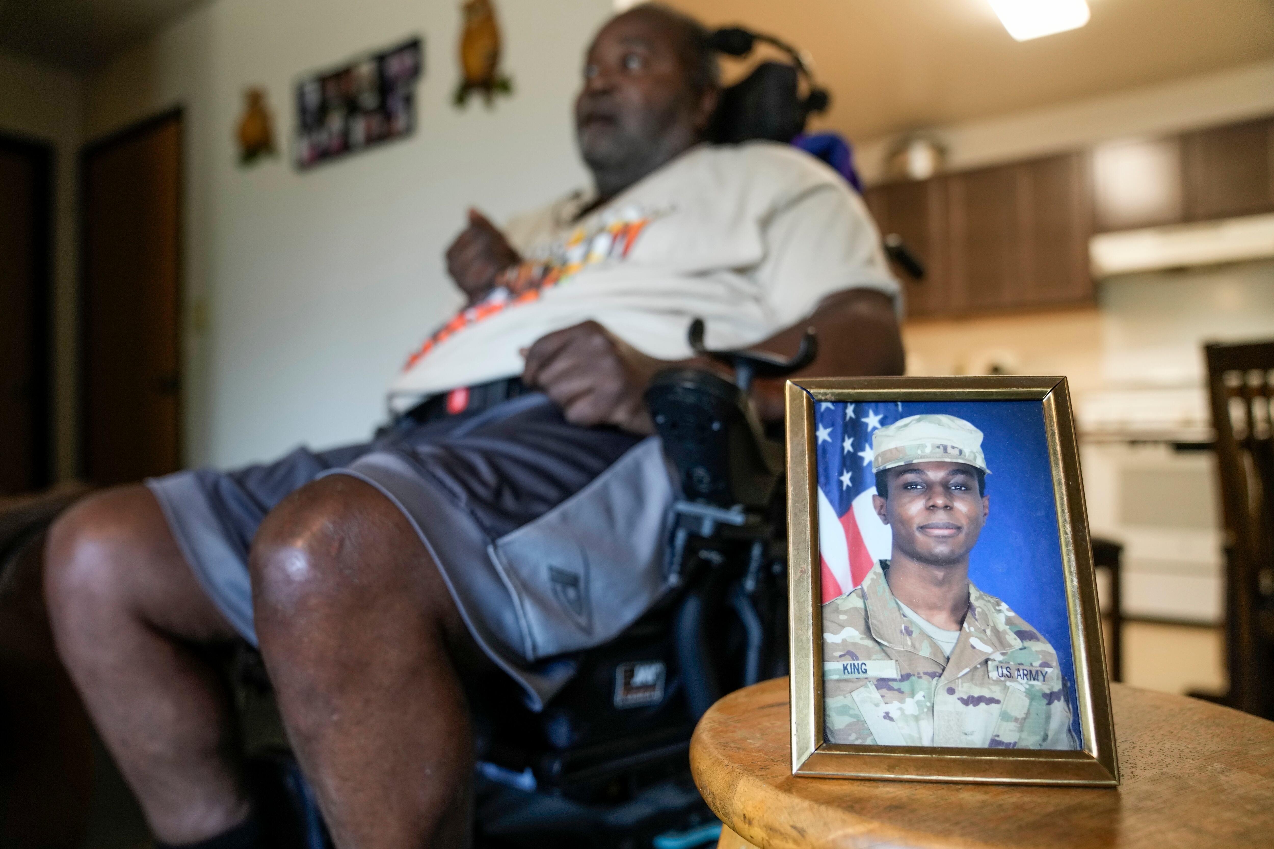 A portrait of American soldier Travis King is displayed as his grandfather, Carl Gates, talks about his grandson Wednesday, July 19, 2023, in Kenosha, Wis