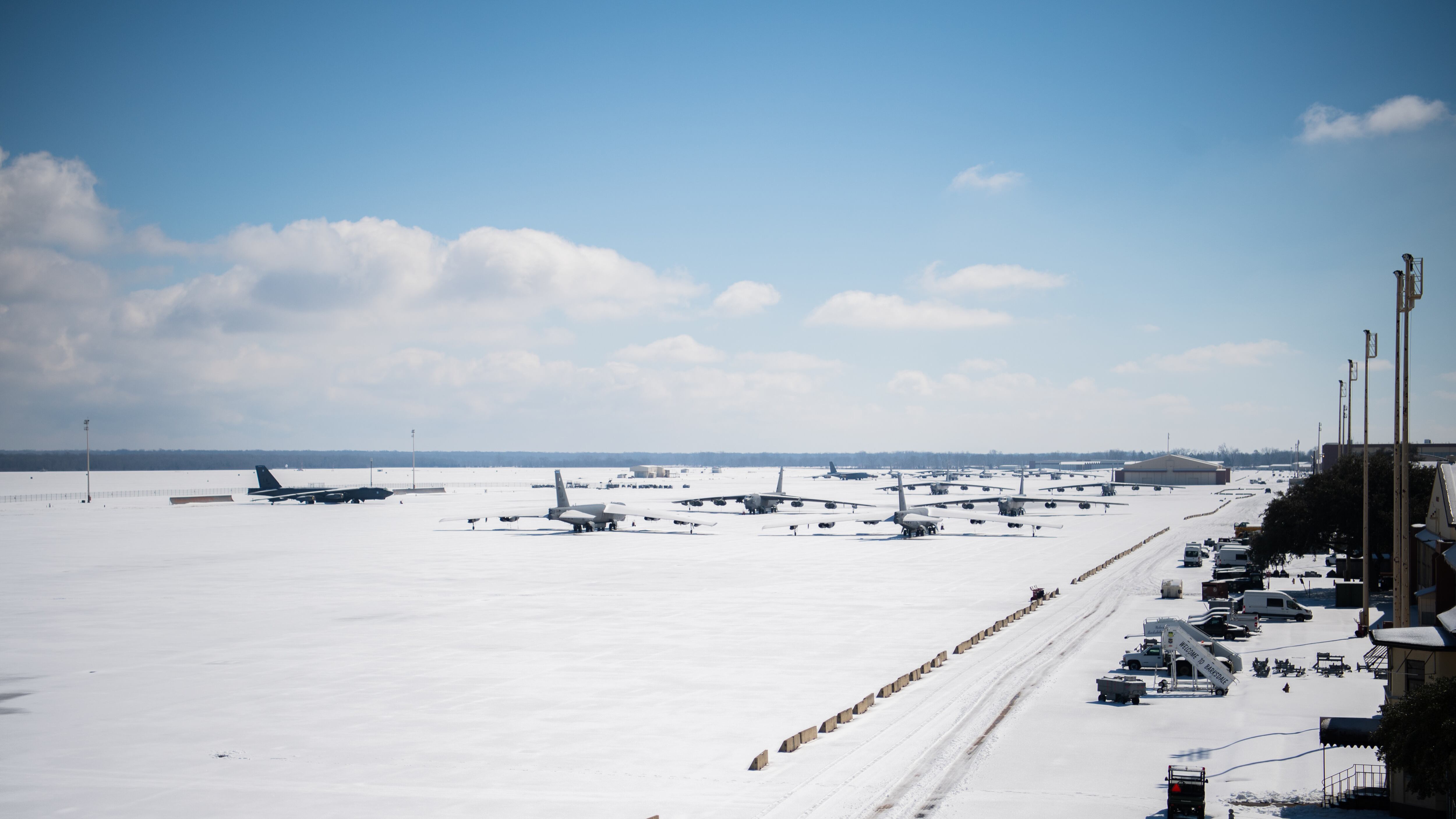 Snow covered B-52H Stratofortresses sit on the flightline at Barksdale Air Force Base, La., Feb. 19, 2021. Barksdale measured approximately four inches of snow Feb. 14 and 15. An additional two inches of snow and sleet were recorded on Feb. 17. (Air Force/Airman 1st Class Jacob Wrightsman)