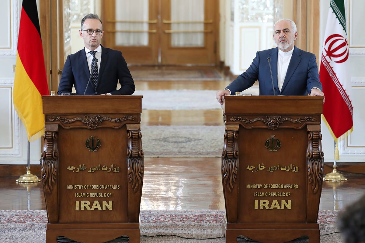 Iranian Foreign Minister Mohammad Javad Zarif, right, and his German counterpart Heiko Maas give a press conference after their talks