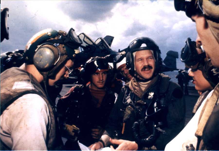 Mark Fox tells his squadron maintenance team and flight deck personnel about the day’s mission.