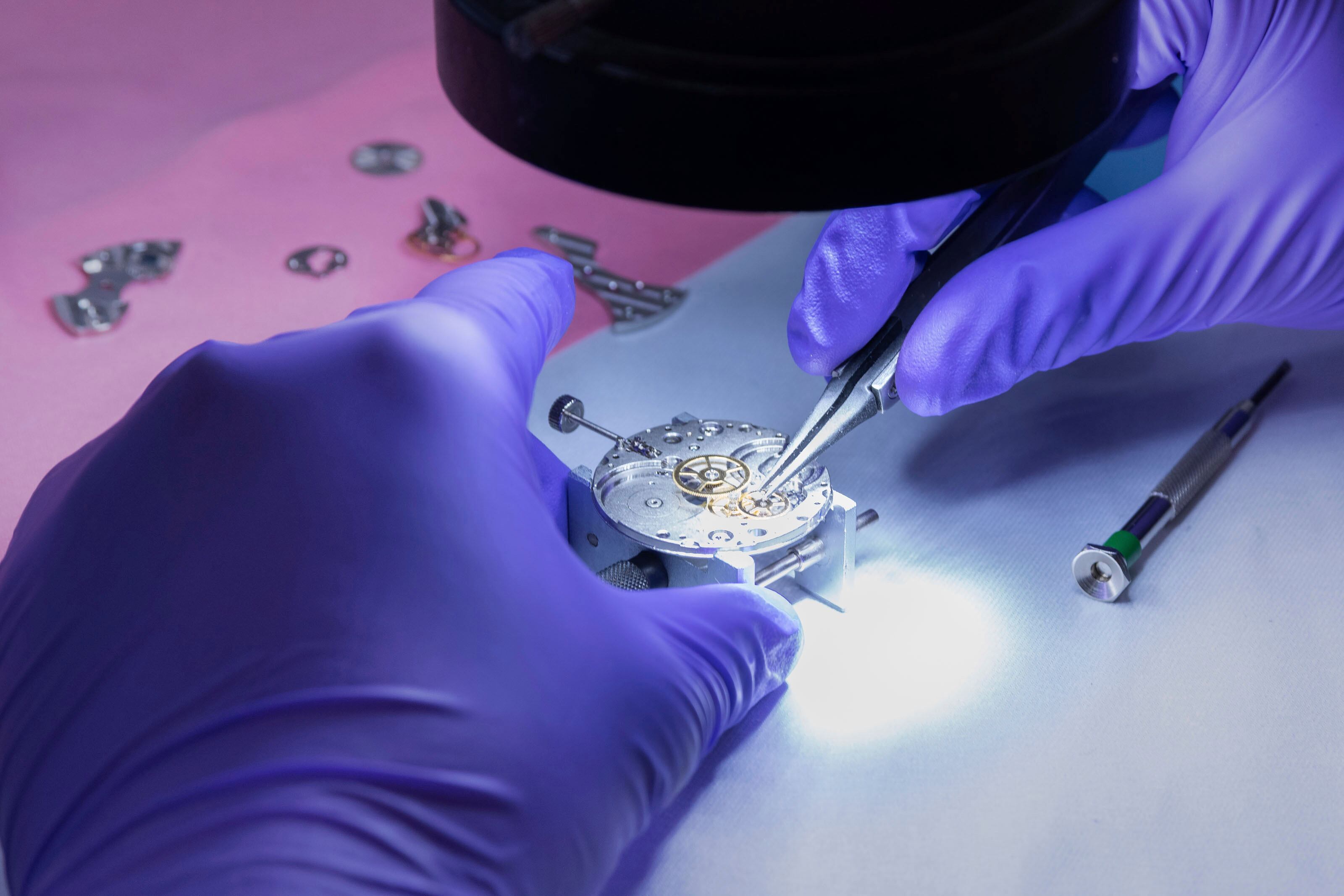 In this photo provided by Kansas City National Security Campus, an employee works on a mechanical wristwatch at the National Nuclear Security Administration's Kansas City facility in Kansas City, Mo., May 23, 2023.