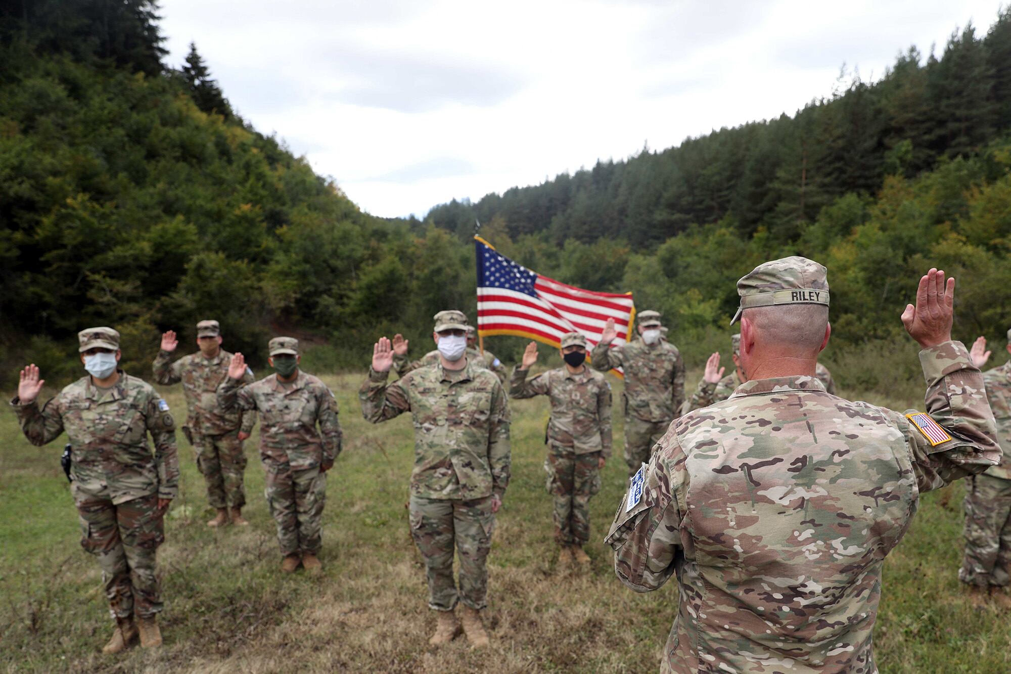 Soldiers from the U.S. Army National Guard and U.S. Army Reserve participate in a reenlistment ceremony Sept. 26, 2020, near Ferizaj/Urosevac, Kosovo.