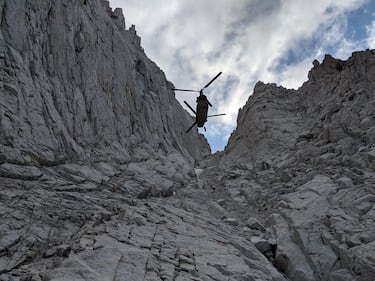 A California Army National Guard CH-47F Chinook helicopter hovers Aug. 25, 2019, as an injured hiker is hoisted on a litter from an area 13,800 feet up Mount Whitney in Inyo County, Calif.