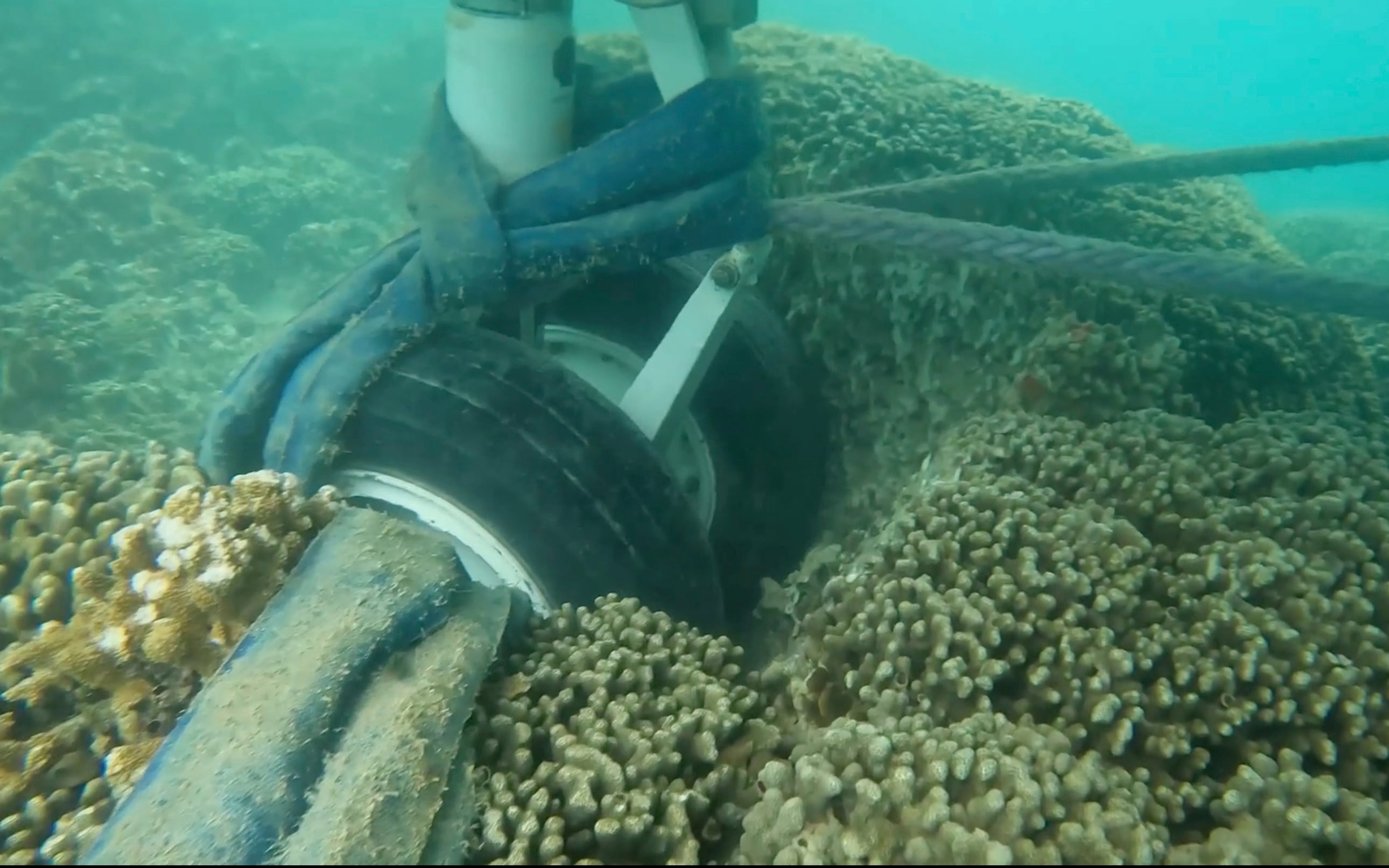 In this image taken from video provided by the U.S. Navy, Navy divers assigned to Mobile Diving and Salvage Unit One conduct an underwater survey of the U.S. Navy's P-8A Poseidon in Kaneohe Bay, Hawaii, on Tuesday, Nov. 28, 2023