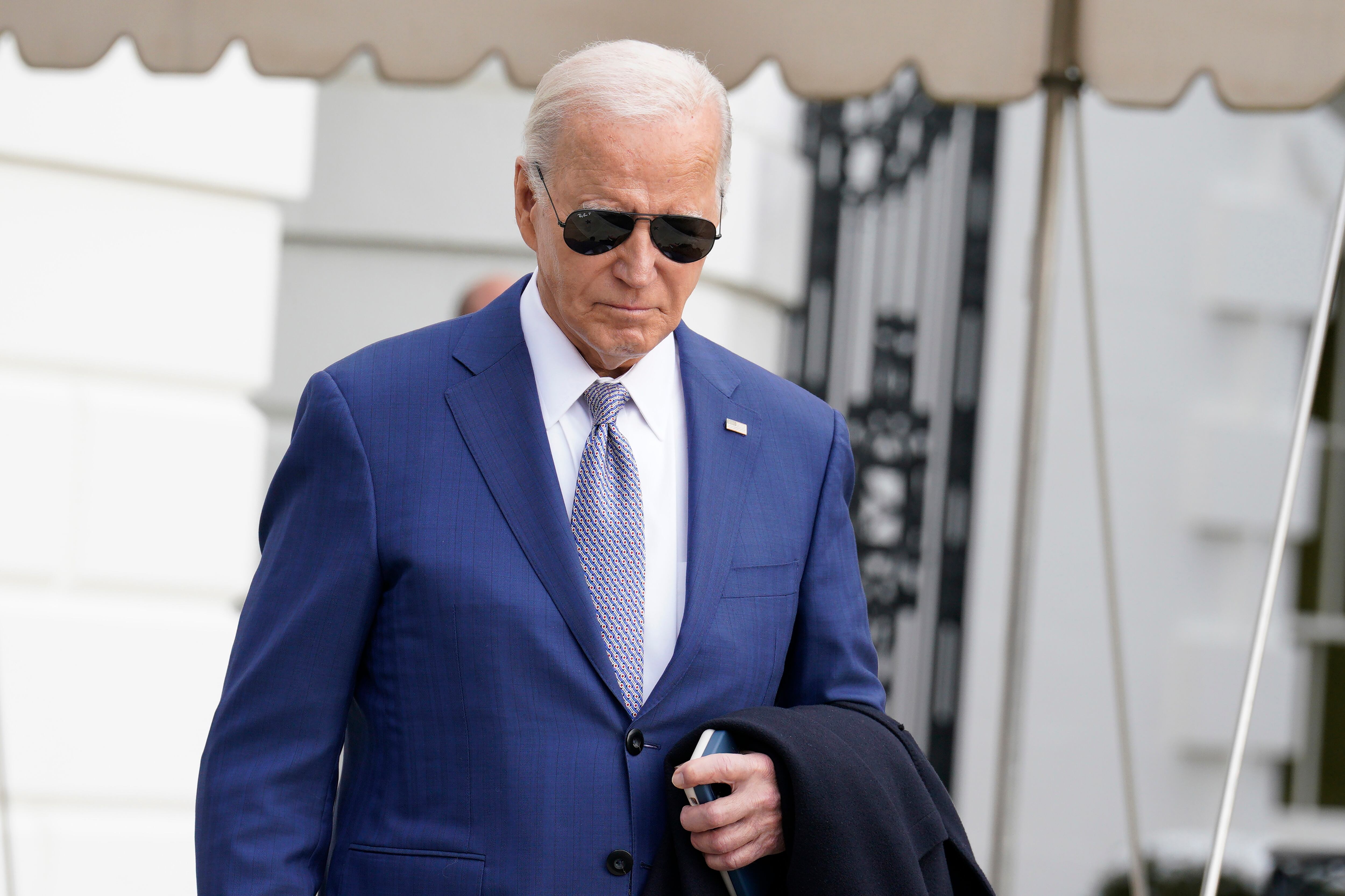 President Joe Biden walks to speak to the media before boarding Marine One on the South Lawn of the White House, Thursday, Jan. 18, 2024, in Washington.