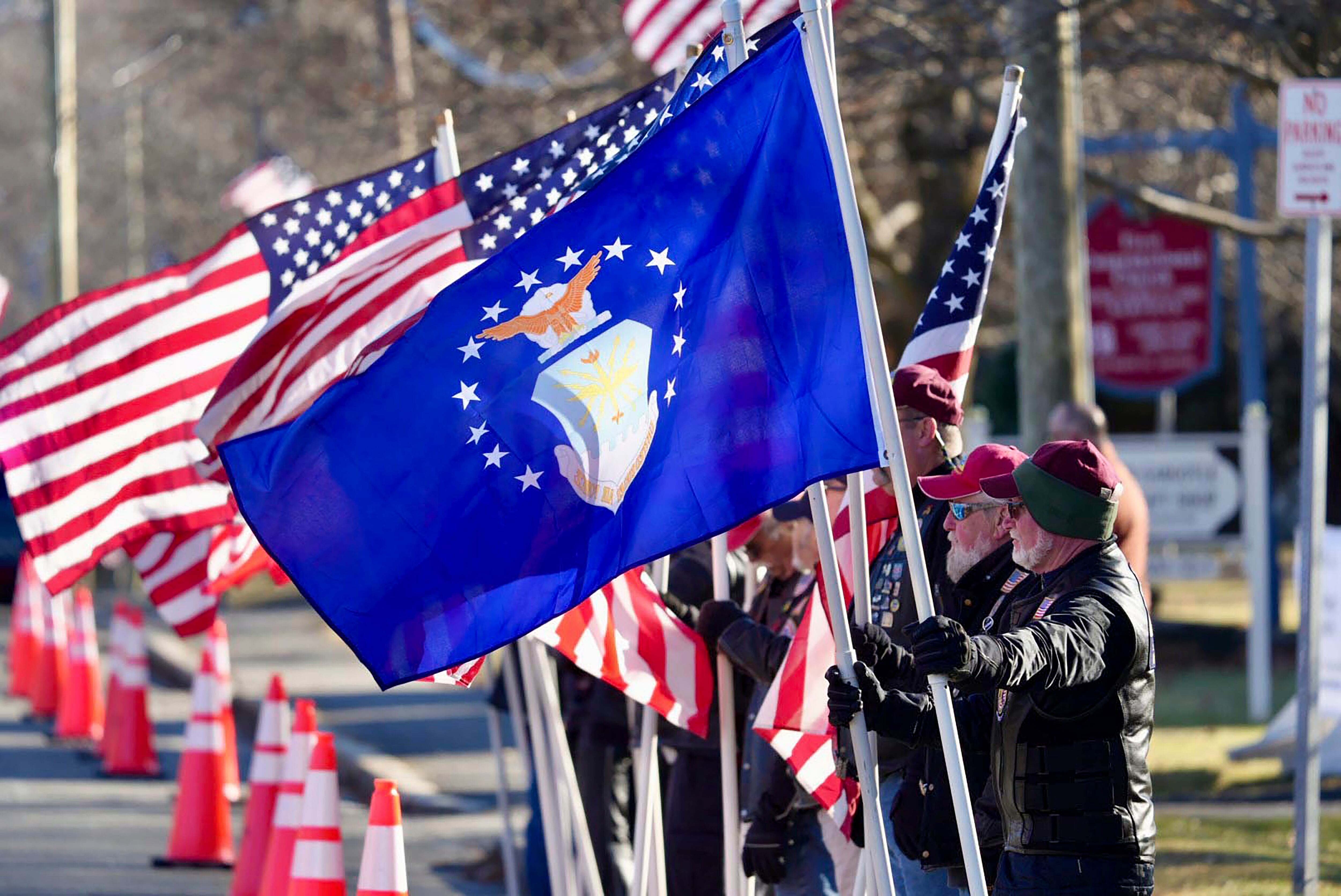 American Legion Riders and the Patriot Guard motorcycle groups line Main Street, Wednesday, Dec. 20, 2023, in Dalton, Mass., for the funeral of Staff Sgt. Jake Galliher of the U.S. Air Force.