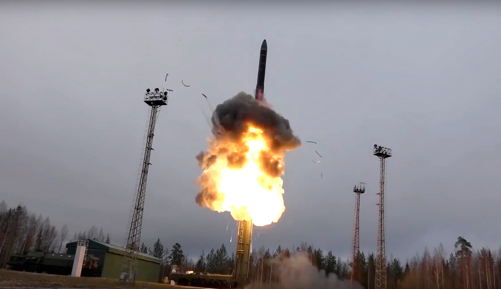 In this photo taken from undated footage distributed by Russian Defense Ministry Press Service, an intercontinental ballistic missile lifts off from a truck-mounted launcher somewhere in Russia.