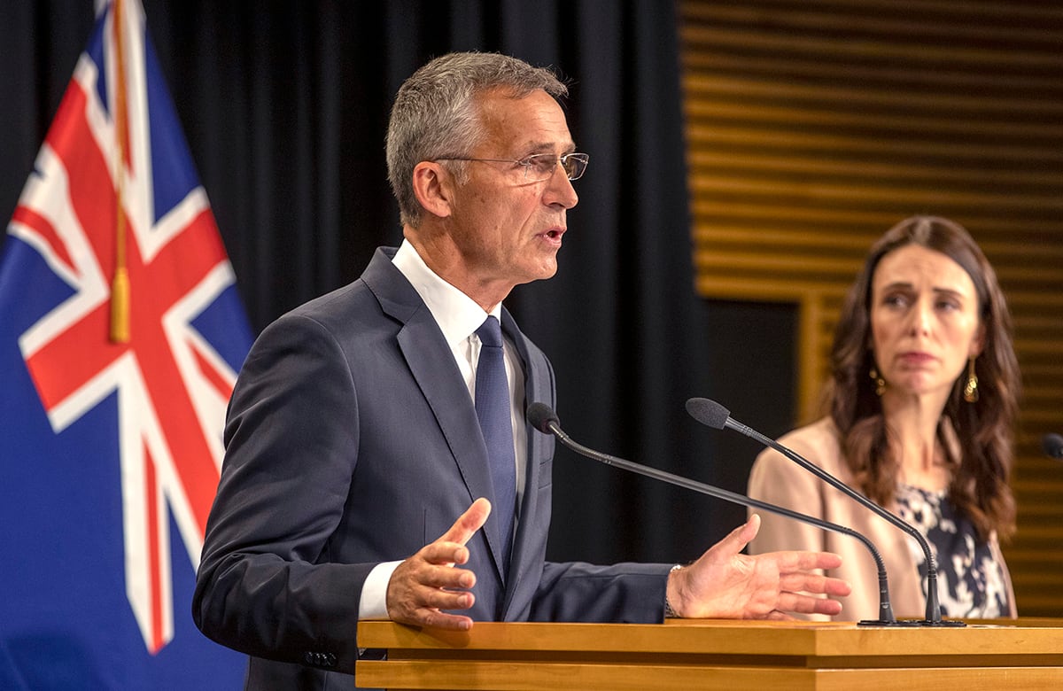 NATO Secretary-General Jens Stoltenberg, left, gestures as he answers questions as New Zealand's Prime Minister Jacinda Ardern watches during a joint press conference at Parliament in Wellington, New Zealand, Tuesday, Aug. 6, 2019.