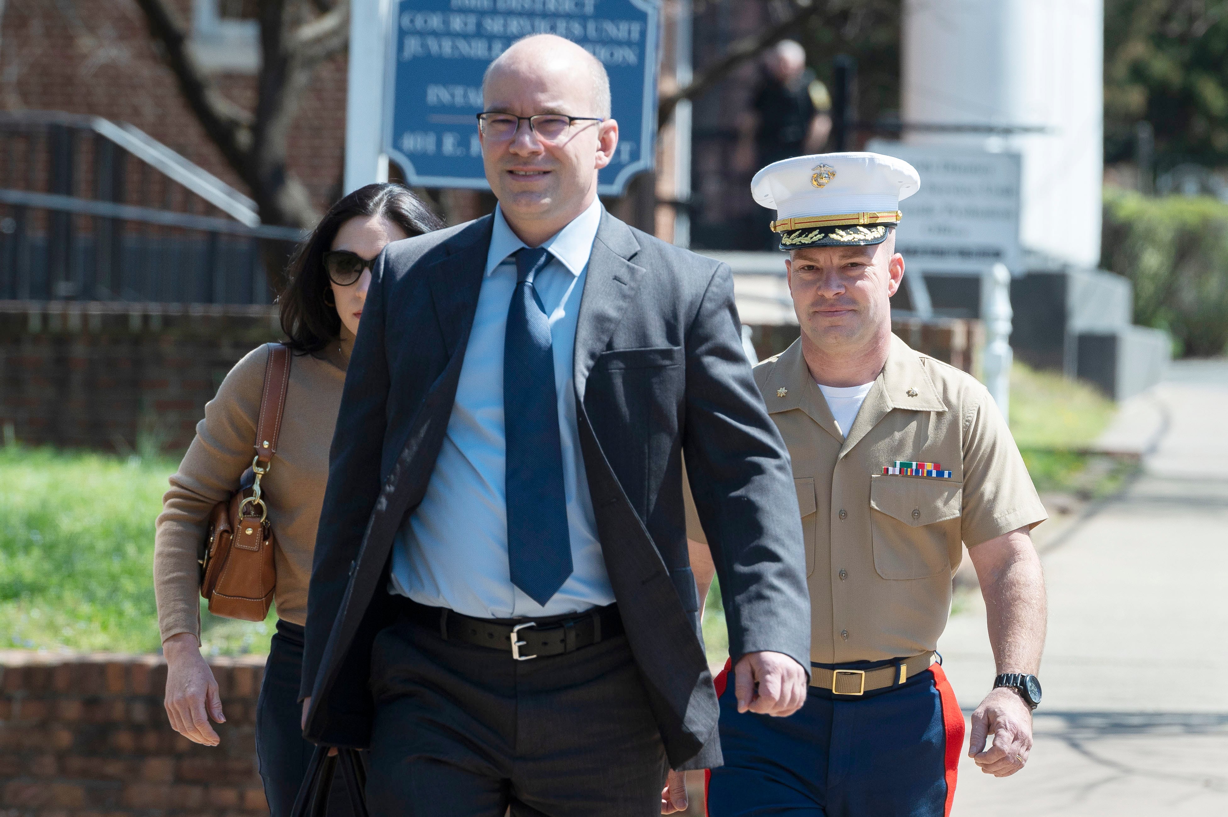 Marine Maj. Joshua Mast and his wife, Stephanie, arrive at Circuit Court, with his attorney and brother, Richard Mast, Thursday, March 30, 2023 in Charlottesville, Va.