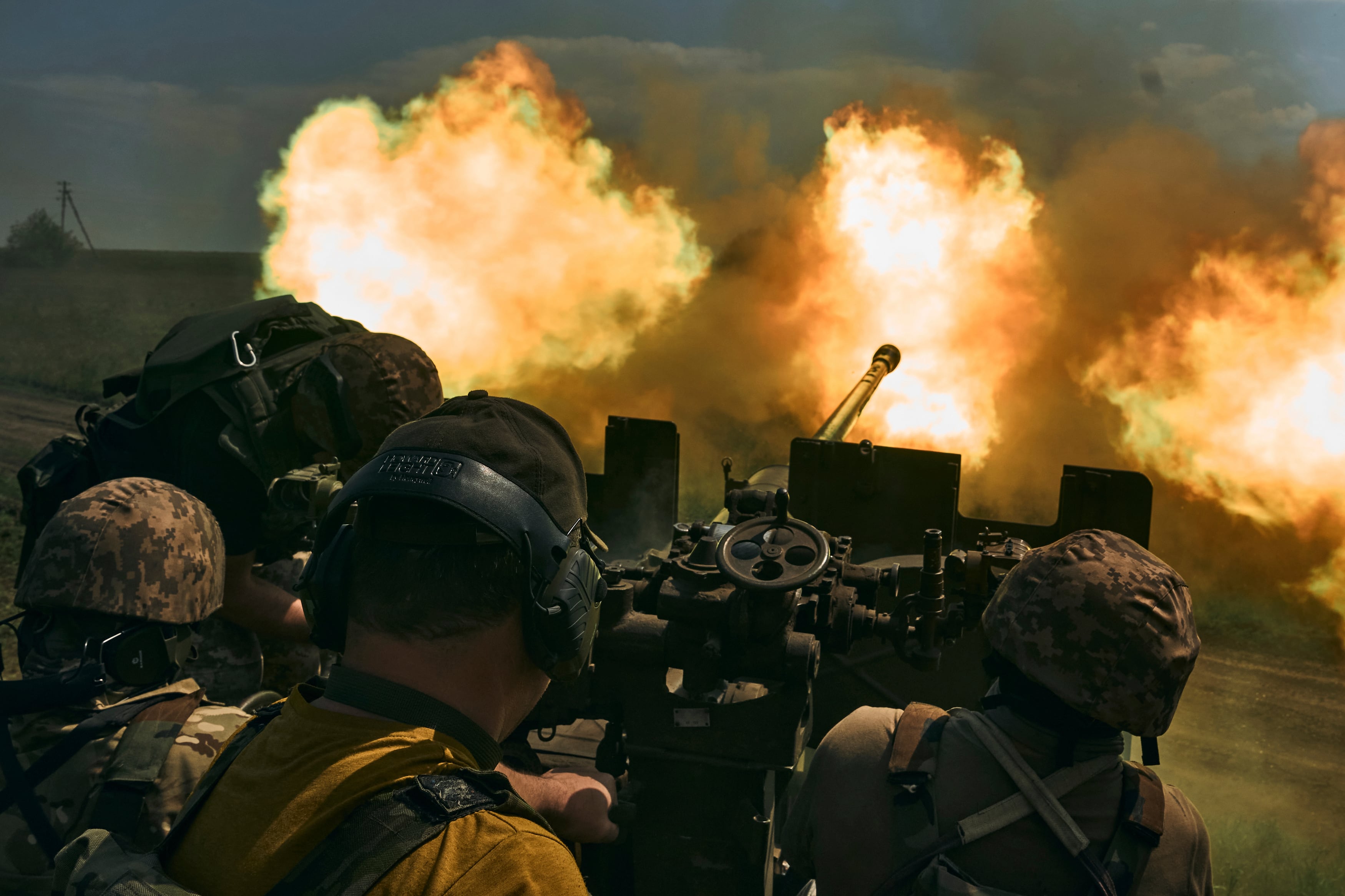 Ukrainian soldiers fire a cannon near Bakhmut, an eastern city where fierce battles against Russian forces have been taking place, in the Donetsk region, Ukraine, Monday, May 15, 2023.