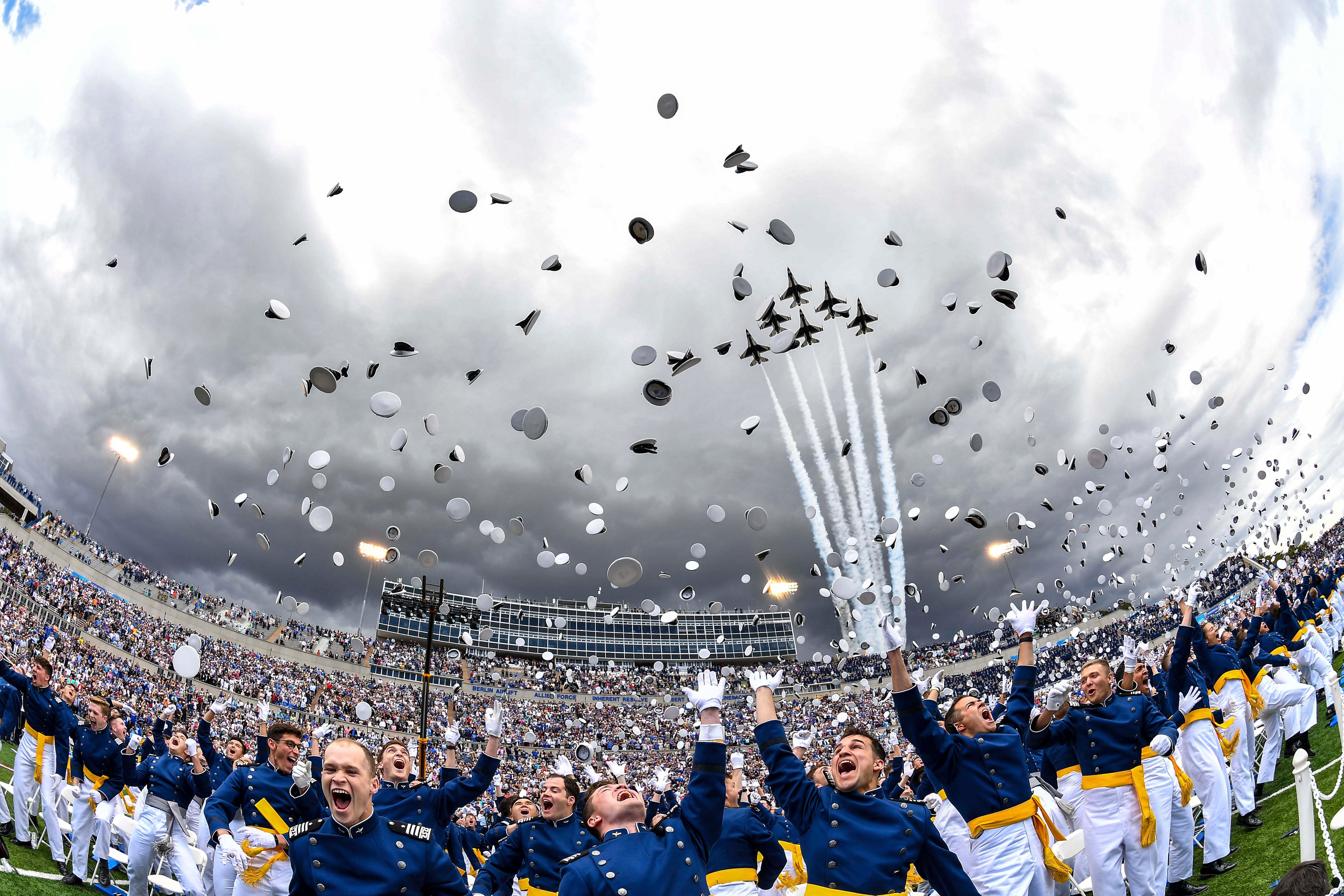 Air Force Academy cadets toss their caps in the air as the Thunderbirds fly overhead during the 2023 graduation ceremony June 1 in Colorado Springs, Colo.