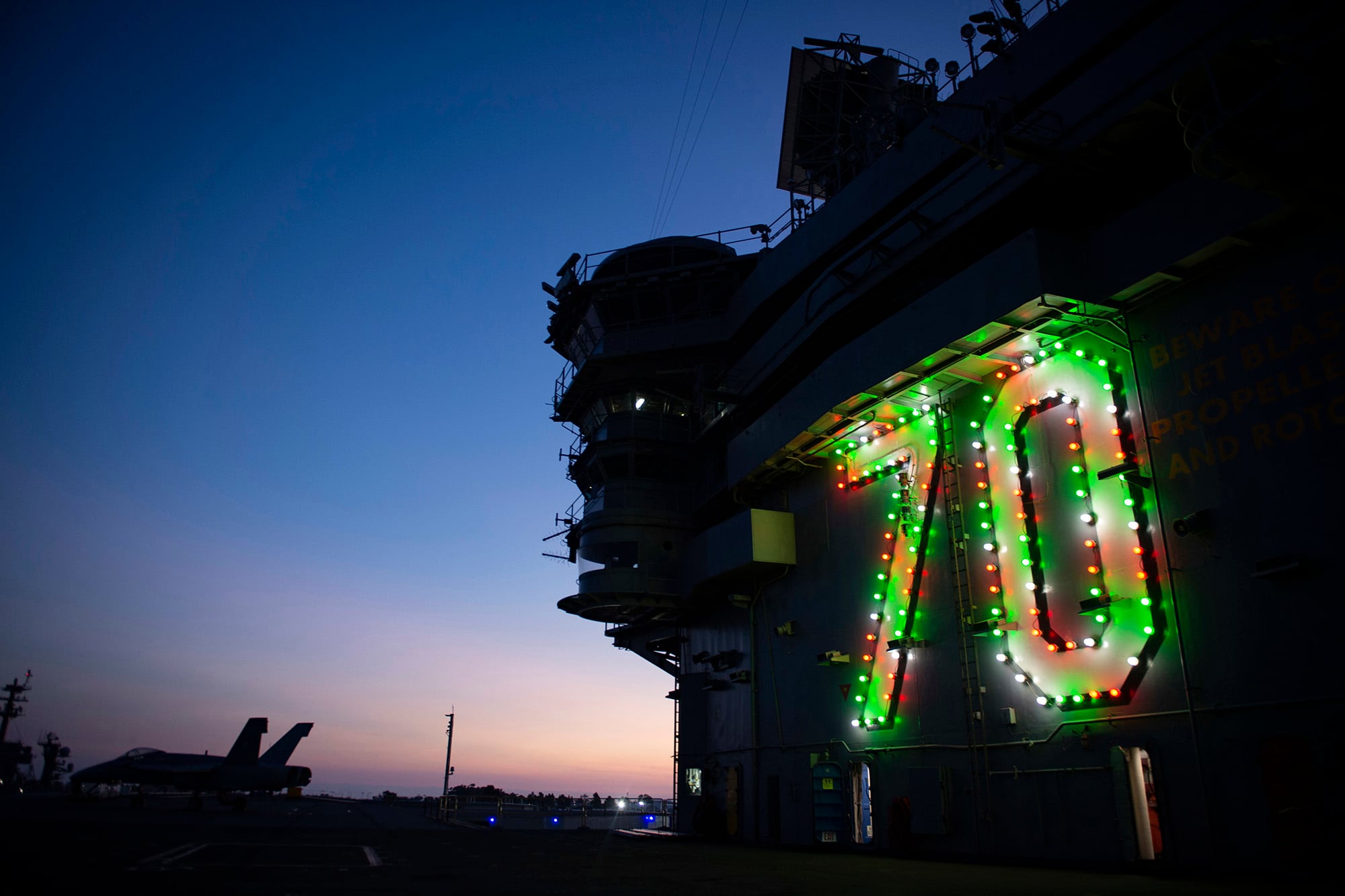 The Nimitz-class nuclear aircraft carrier USS Carl Vinson (CVN 70) displays holiday lights on the island in celebration of the holiday season on Nov. 26, 2020, in San Diego.