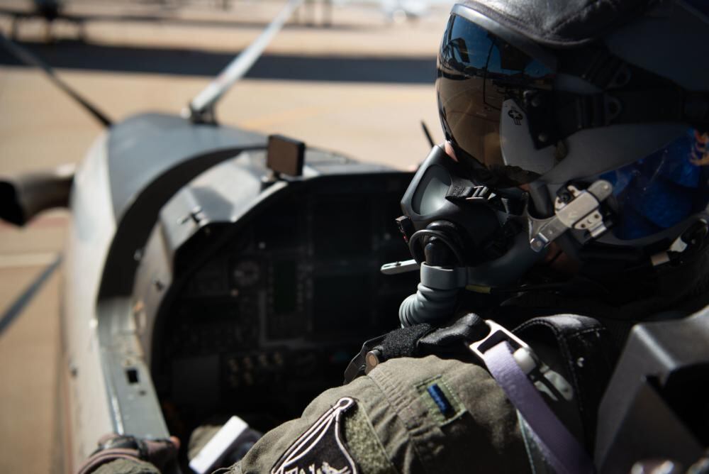 1st Lt. Colton Fisher, a 33rd Flying Training Squadron instructor pilot, prepares for flight at Vance Air Force Base, Okla. Oct. 26, 2022. Fisher conducted preflight inspections in a T-6A Texan II, checking the aircraft’s interior for safety discrepancies. (Airman 1st Class Ashley Crist/Air Force)