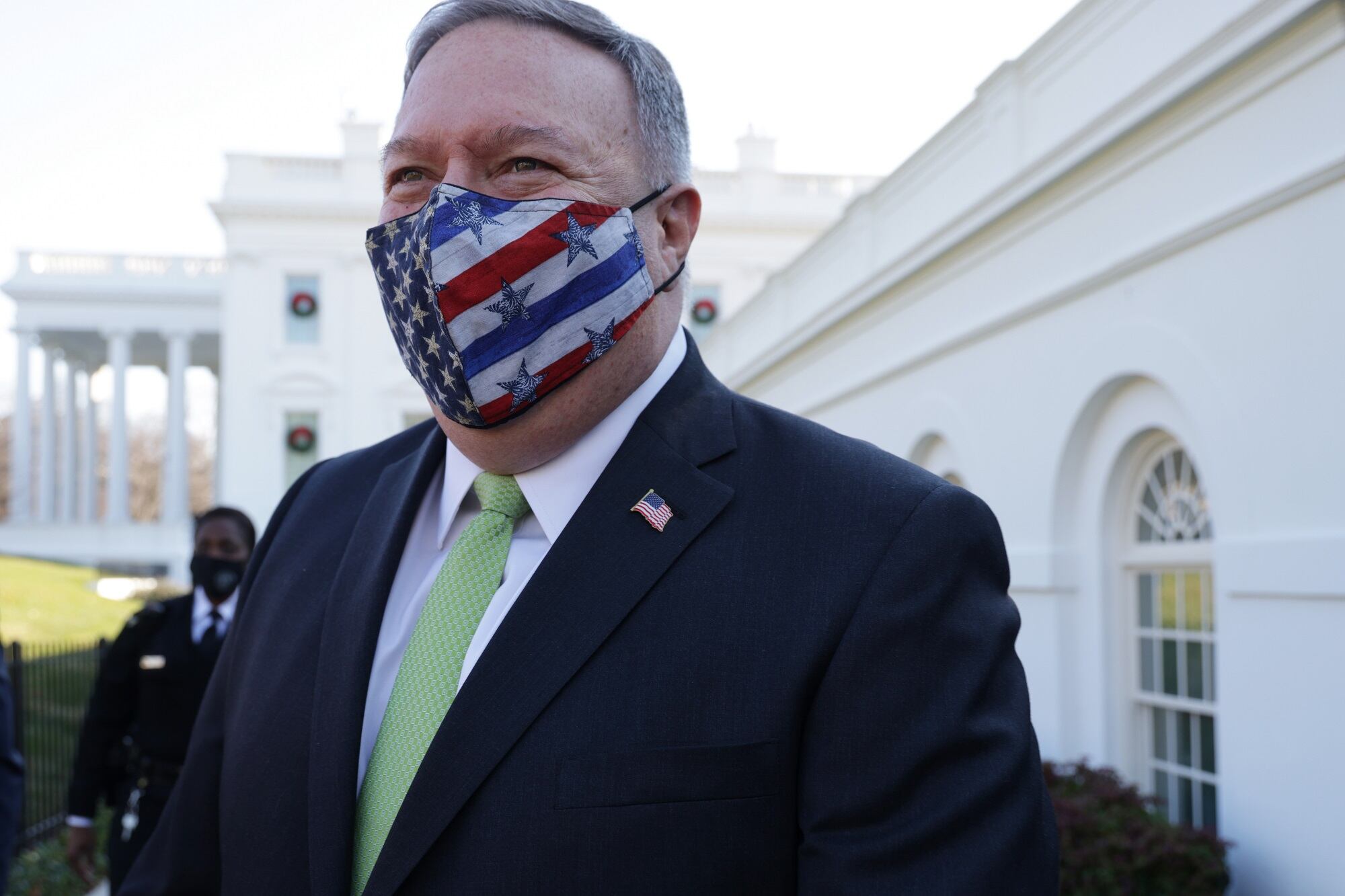 Secretary of State Mike Pompeo walks on the grounds of the White House Dec. 11, 2020, in Washington.