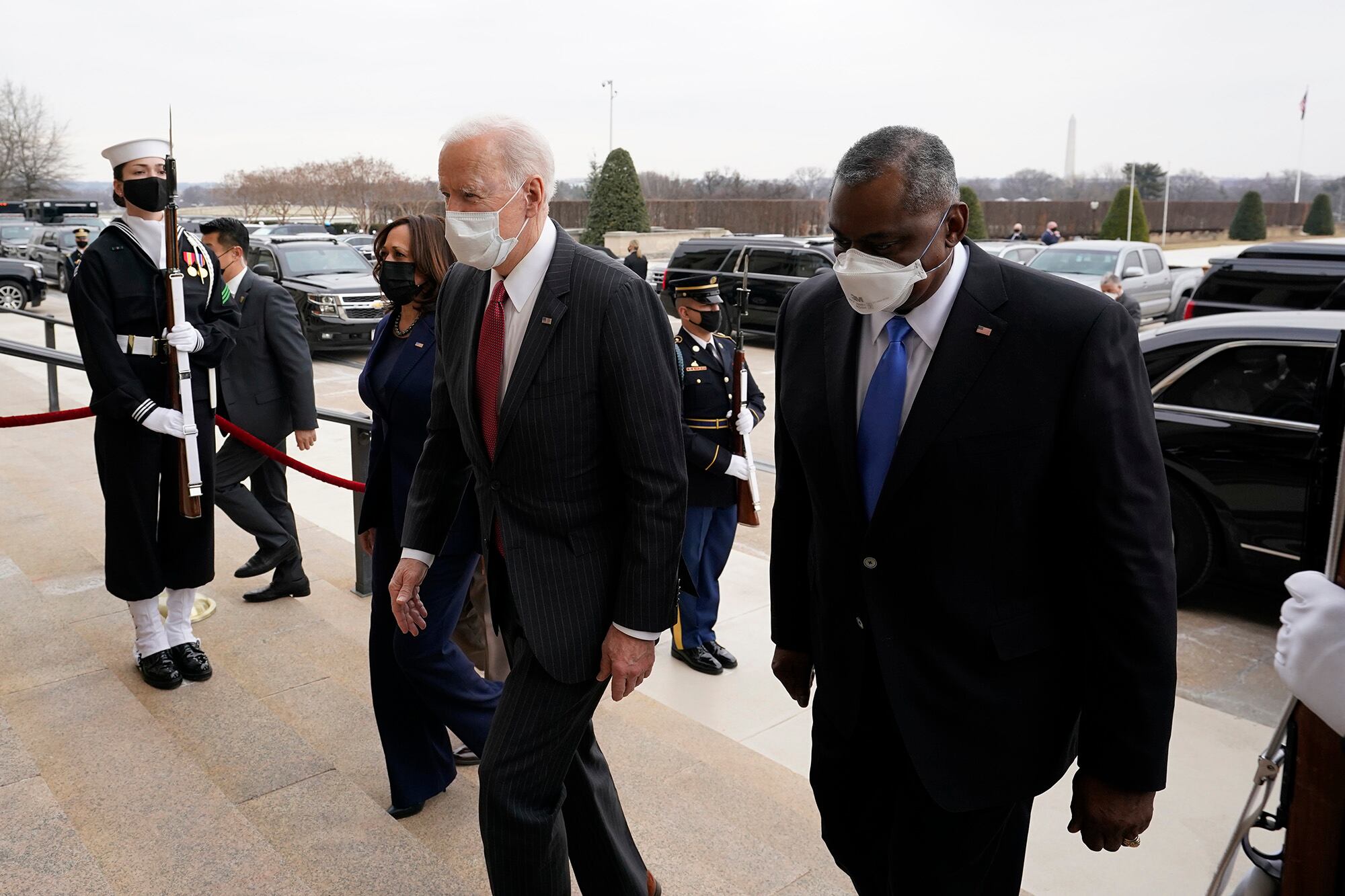 President Joe Biden and Vice President Kamala Harris walk with Secretary of Defense Lloyd Austin at the Pentagon, Wednesday, Feb. 10, 2021, in Washington.