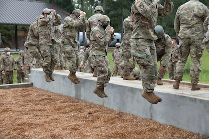 A group of U.S. Army paratroopers conducts a Parachute Landing Fall at the Warrior Training Center, Fort Benning, Ga., Aug. 24, 2020.