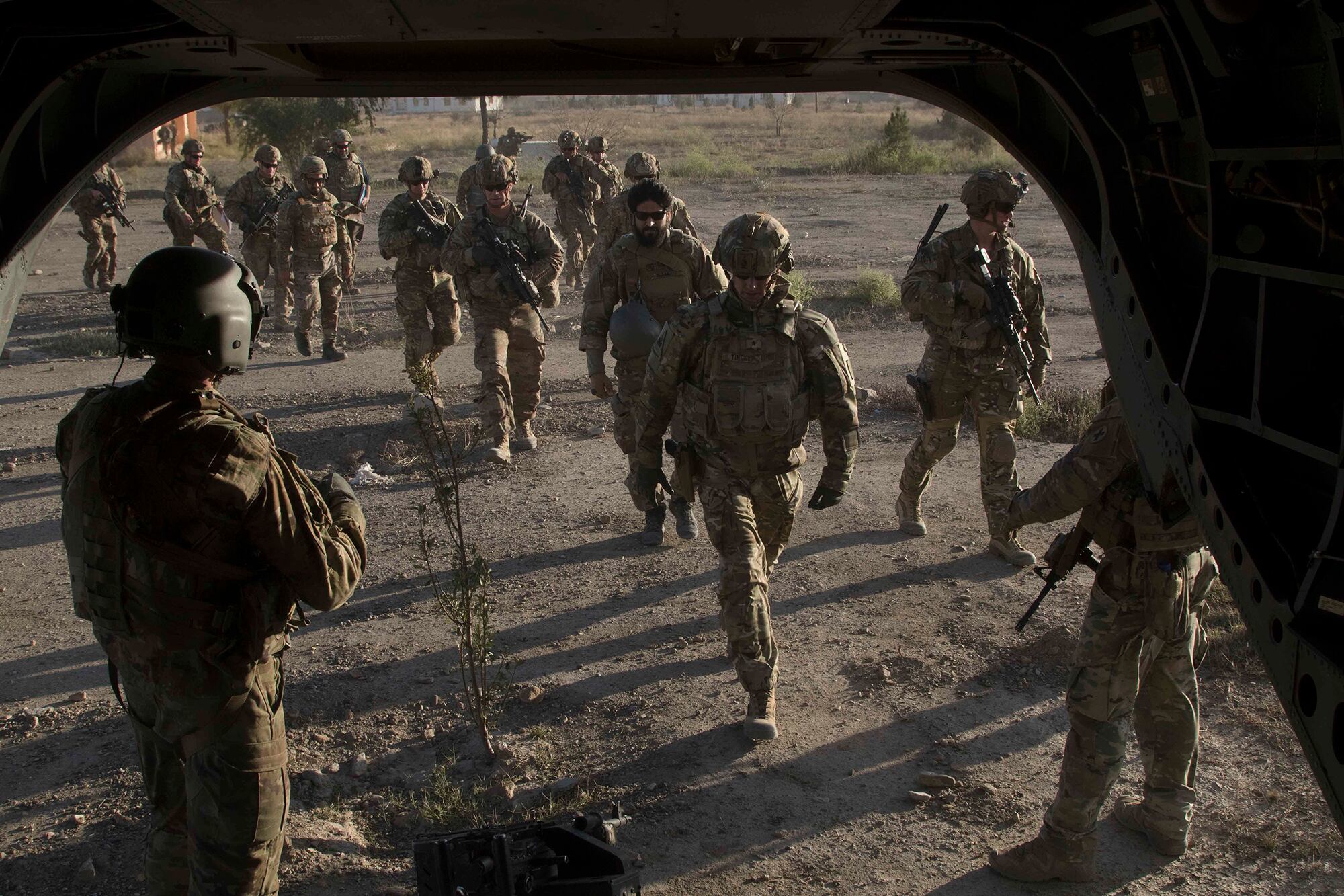 American and Afghan National Army soldiers board a CH-47 Chinook helicopter following a key leader engagement Dec. 2, 2019, with senior Afghan government officials to discuss ongoing security efforts in southeastern Afghanistan.