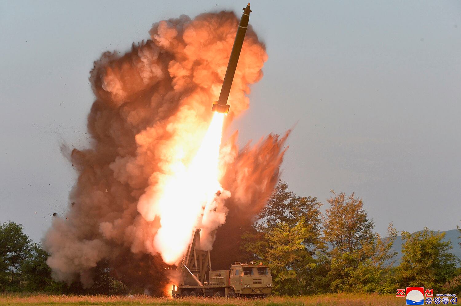 A test-firing from a multiple rocket launcher at an undisclosed location in North Korea is seen in this Sept. 10, 2019, photo.