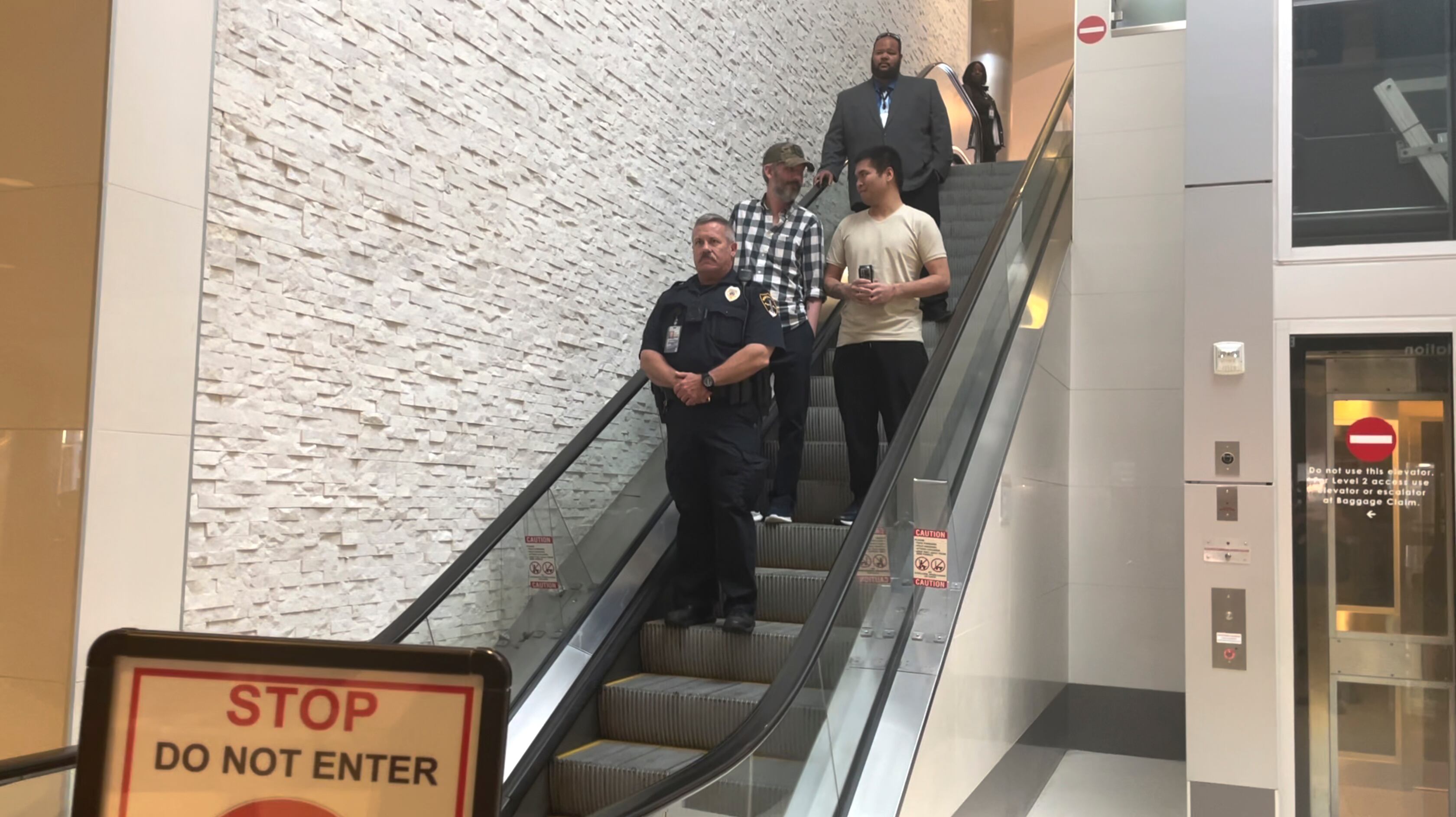 Andy Huynh, left, and Alex Drueke, right, are seen arriving at Birmingham-Shuttlesworth International Airport in Birmingham, Ala., Saturday, Sept. 24, 2022.