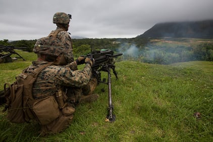 Marines fire a Mark 19 automatic grenade launcher during training at Camp Schwab, Okinawa